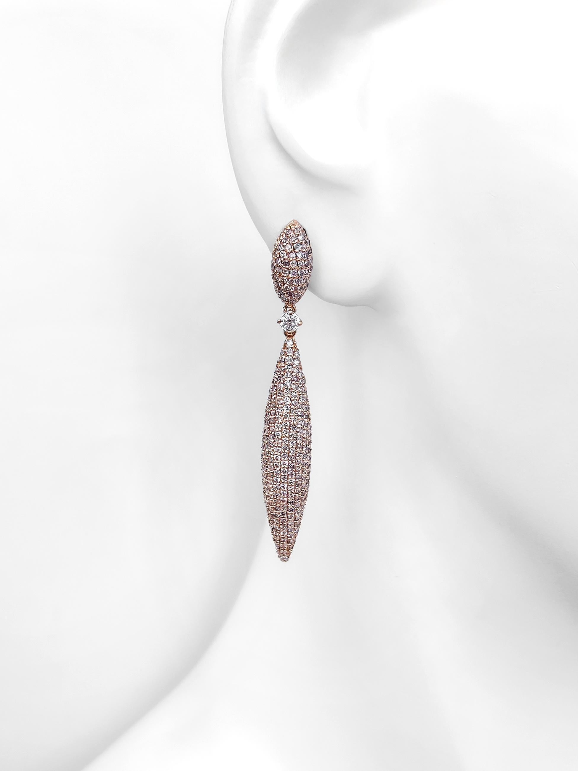 FOR THE USA CUSTOMERS NO VAT

With 454 natural diamonds, weighing 3.02 carats in total, delicately arranged in a stunning cascade, these drop earrings are a true masterpiece. The captivating shades of faint pink to fancy purplish pink, coupled with