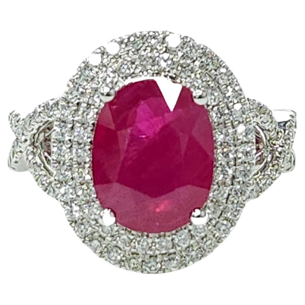 Indulge in the ultimate luxury with this IGI Certified 3.42 Carat ruby ring, an exquisite masterpiece that combines exceptional gemstones and modern design. With its deep purplish red color and oval shape, this rare and extraordinary ruby captivates
