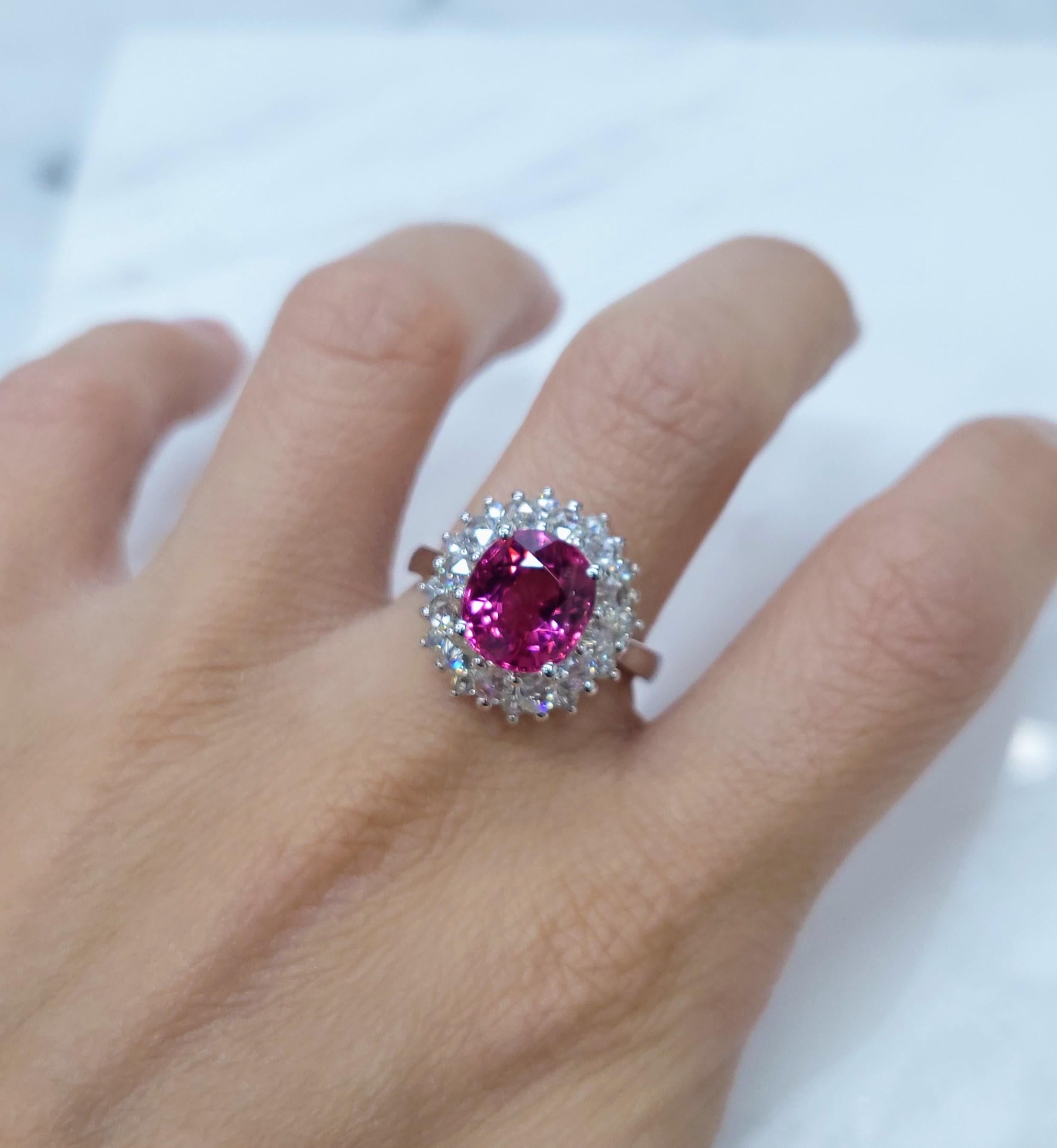 Prepare to be mesmerized by the exquisite IGI certified 18K white gold Rubellite Tourmaline Diamond Ring, a breathtaking masterpiece that captivates with its stunning natural beauty and impeccable craftsmanship.

At the heart of this extraordinary