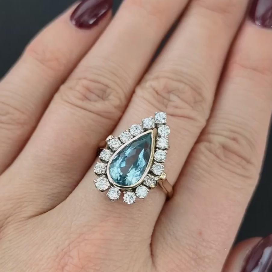 Dive into the captivating depths of the ocean with this magnificent cocktail ring, featuring a breathtaking 3.80ct pear-shaped natural aquamarine. Its enchanting blue hue is strikingly saturated, offering a glimpse of the sea's infinite beauty.

Key