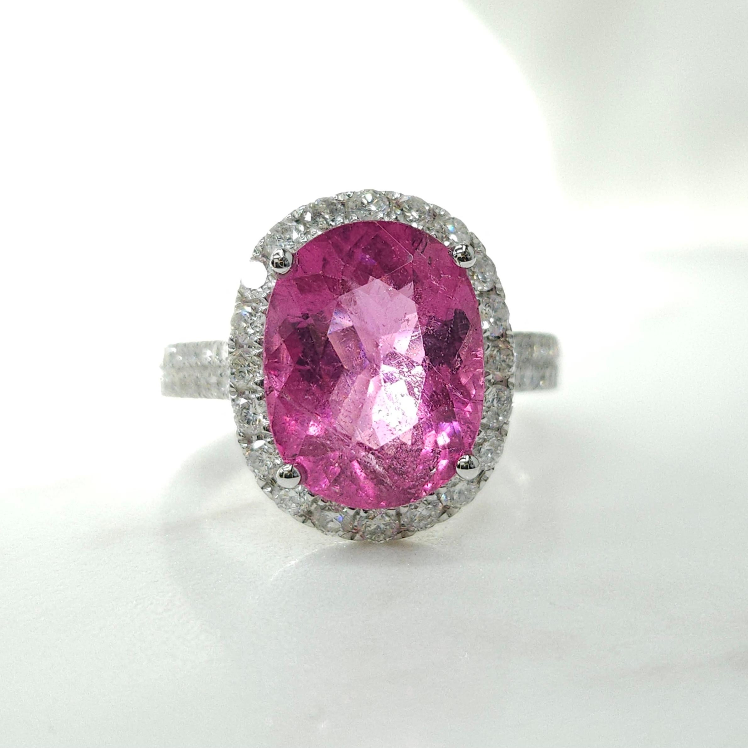 Prepare to be mesmerized by the exquisite IGI certified 18K white gold Rubellite Tourmaline Diamond Ring, a breathtaking masterpiece that captivates with its stunning natural beauty and impeccable craftsmanship.

At the heart of this extraordinary