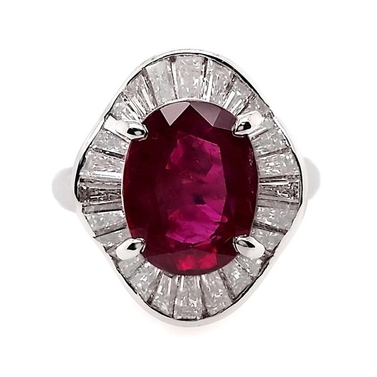 AMAZING Platinum Ring showcasing a 3.87ct Natural, Not-Heated Thai Ruby accented by 1.71ct Natural Diamonds.
The centrepiece is an exceptional Oval Mixed-Cut Ruby from Thailand, in a vivid Intense Purplish Red hue, boasting transparency and a