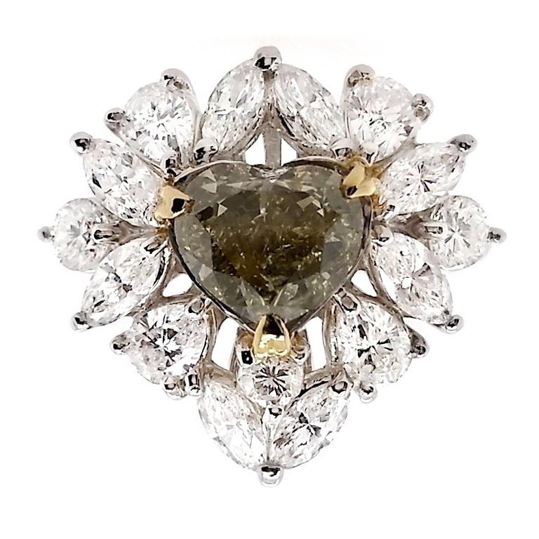 Step into the extraordinary with a 2-carat heart-cut brilliant natural fancy diamond, emanating a captivating brownish-greenish-yellow hue. Enhanced by the luminosity of 1.92 carats of D-F mix brilliant shining diamonds, this masterpiece is a