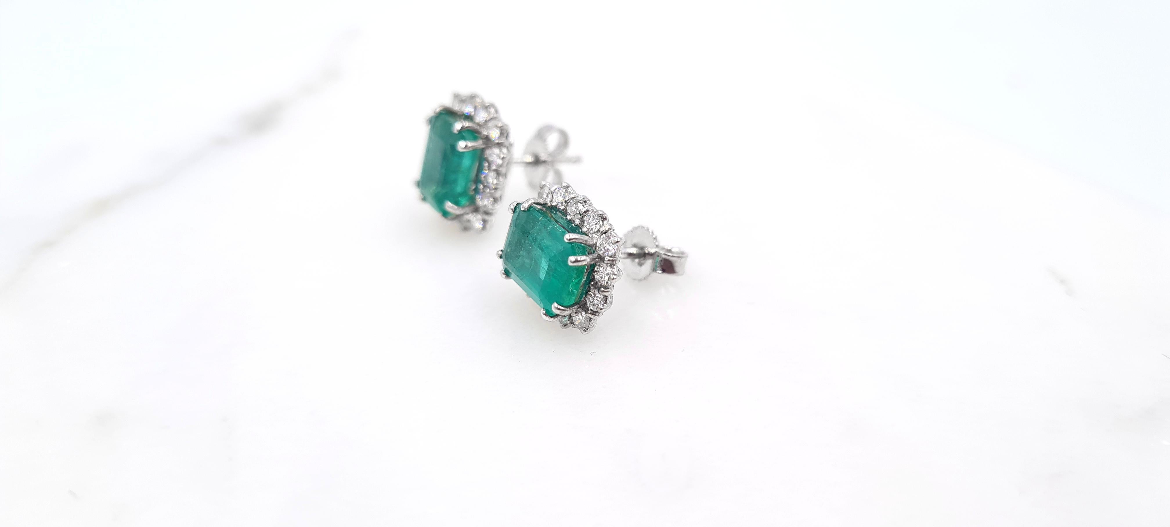 Fantastic IGI Certified 3.98 Ct Emerald Cut Emerald Earrings.
The emeralds weigh 1.84 Carats and 2.04 Carats respectively and are
surrounded by 0.60 Carat of round brilliant diamonds in G quality for 
color and VS for clarity.