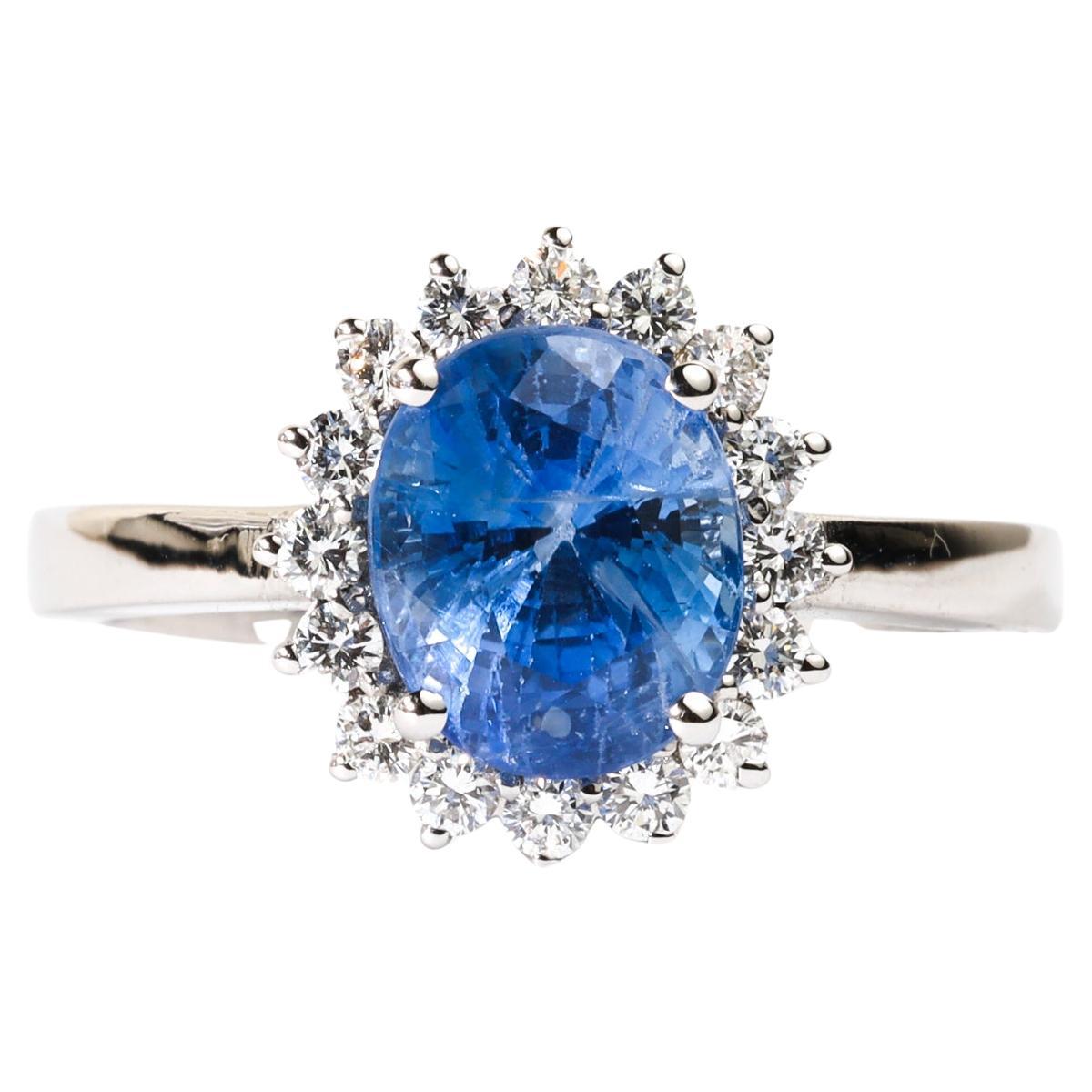 IGI Certified 3ct Oval Heated Blue Sapphire & Diamond Halo Ring – 18K White Gold For Sale