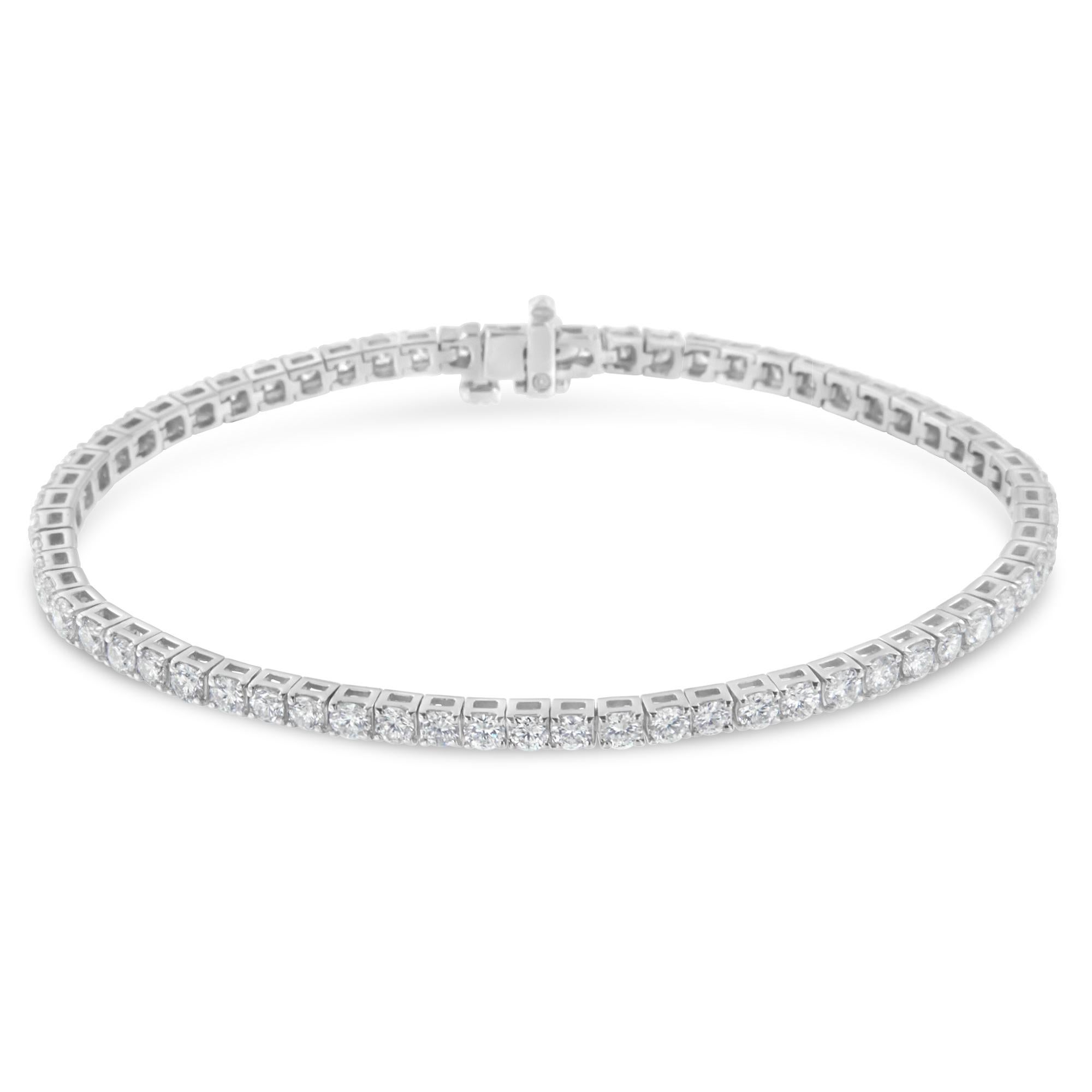 Elevate her attire with the luxe look of this magnificent diamond tennis bracelet. Elegant and timeless, this gorgeous 14K white gold bracelet features 4 carats total weight of round cut diamonds in four prong settings. The 7” bracelet fastens