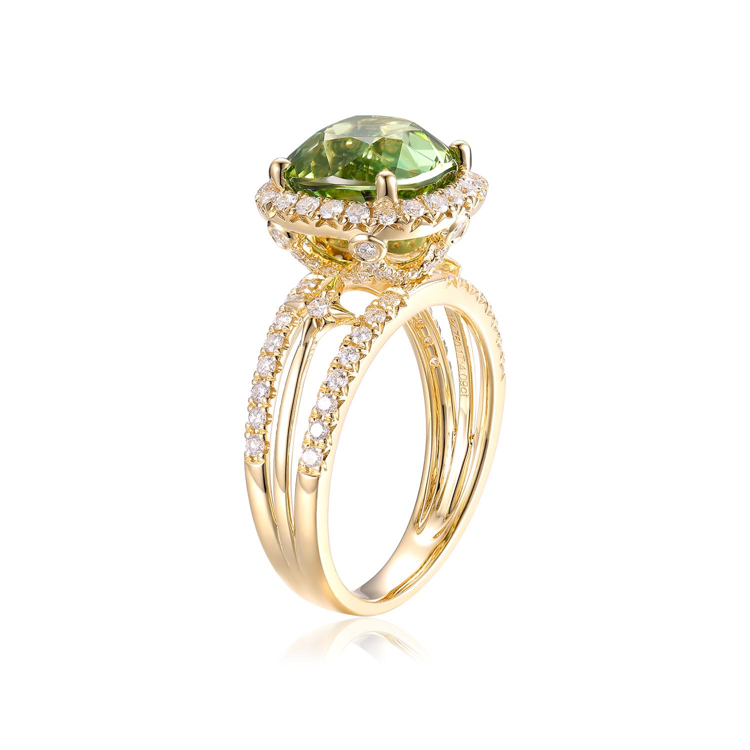 This exquisite ring features a magnificent 4.09-carat green tourmaline, showcasing its vibrant color and brilliance. The cushion-cut green tourmaline, known for its deep, rich hue, takes center stage, exuding a timeless elegance that captures