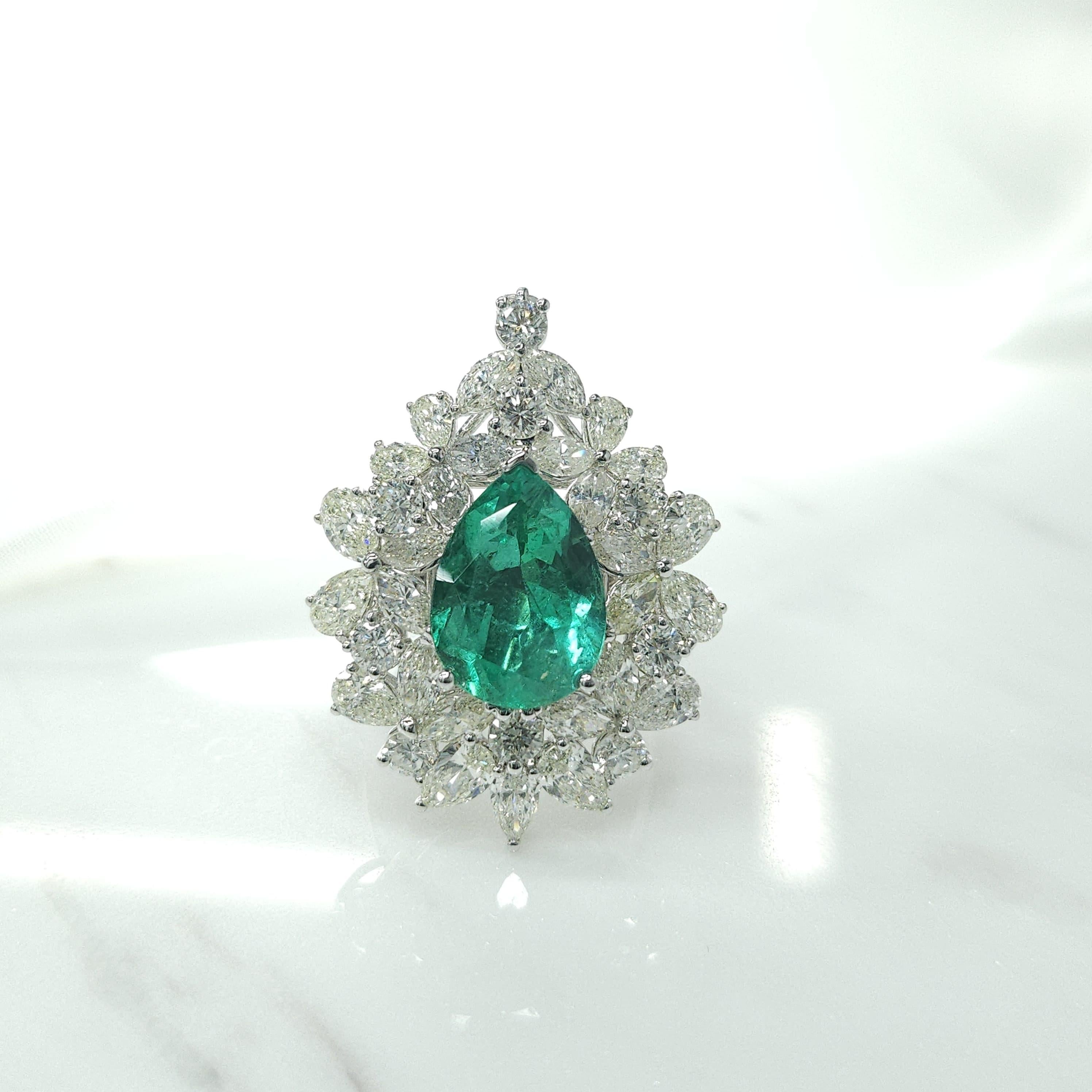 Introducing the breathtaking IGI Certified 4.19 Carat Colombian Emerald Diamond Ring Pendant 2-way in 18K White Gold, a true masterpiece of luxury and versatility. This extraordinary piece showcases a single pear-shaped Colombian emerald in an