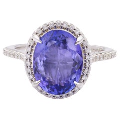 Anello con tanzanite certificata IGI da 4,21 carati e diamante da 0,40 carati in oro bianco 14K