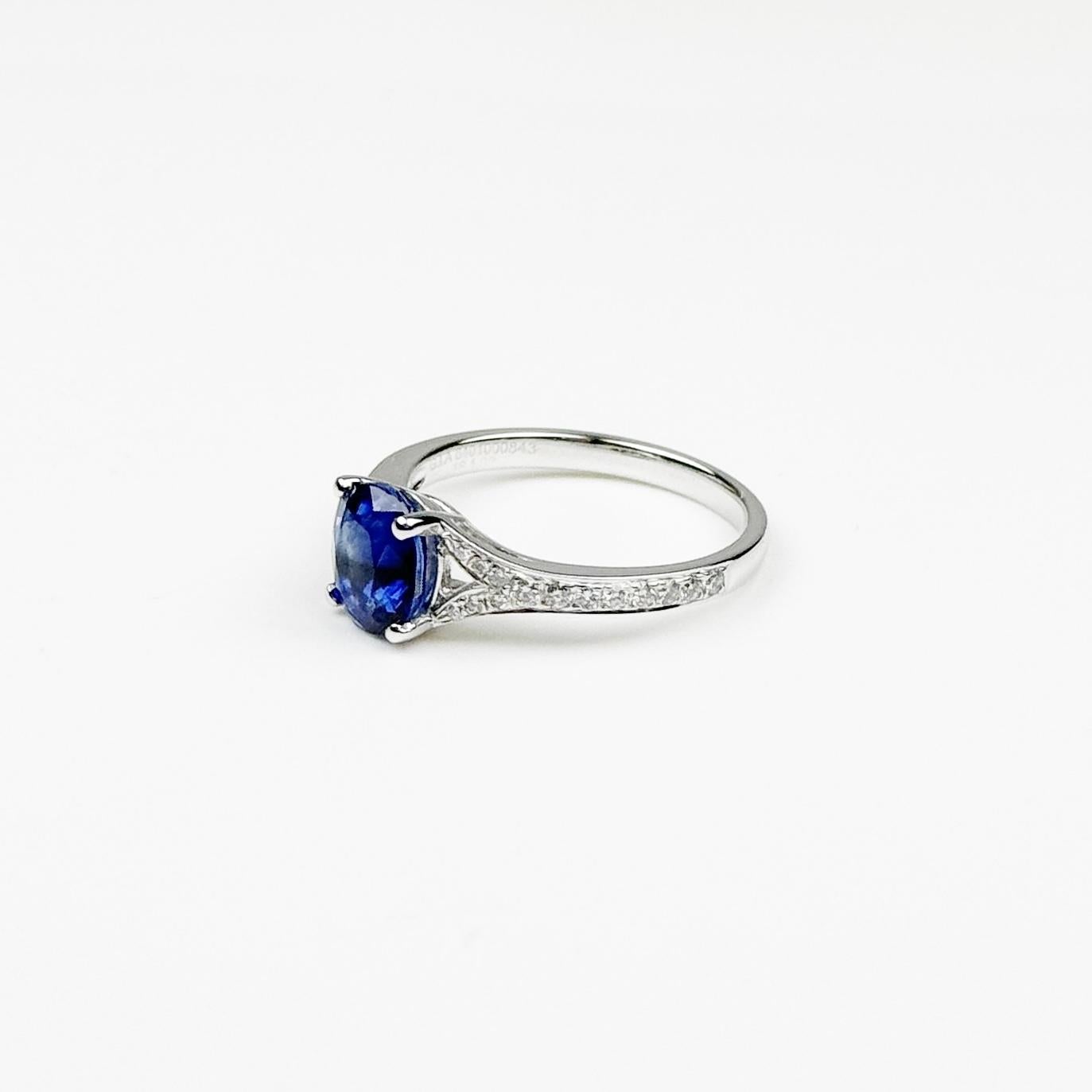 Presenting a stunning Sri Lankan Blue Sapphire ring, a timeless piece that embodies elegance and sophistication. The centerpiece of this exquisite ring is a 1.99-carat oval-cut blue sapphire, known for its deep, vibrant hue, and impeccable clarity.