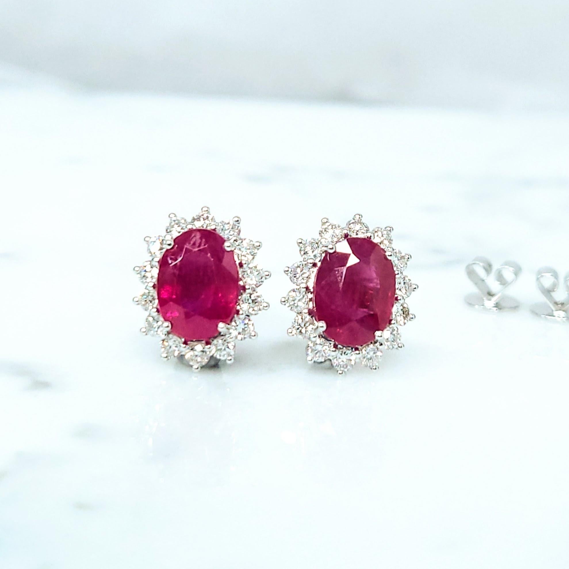 Radiant 18K White Gold Earrings with Two Vivid Purple Rubies and Shimmering Diamonds

These exquisite earrings feature two oval mixed-cut rubies, each boasting a captivating purplish-red hue that evokes a sense of regal elegance. The rubies,
