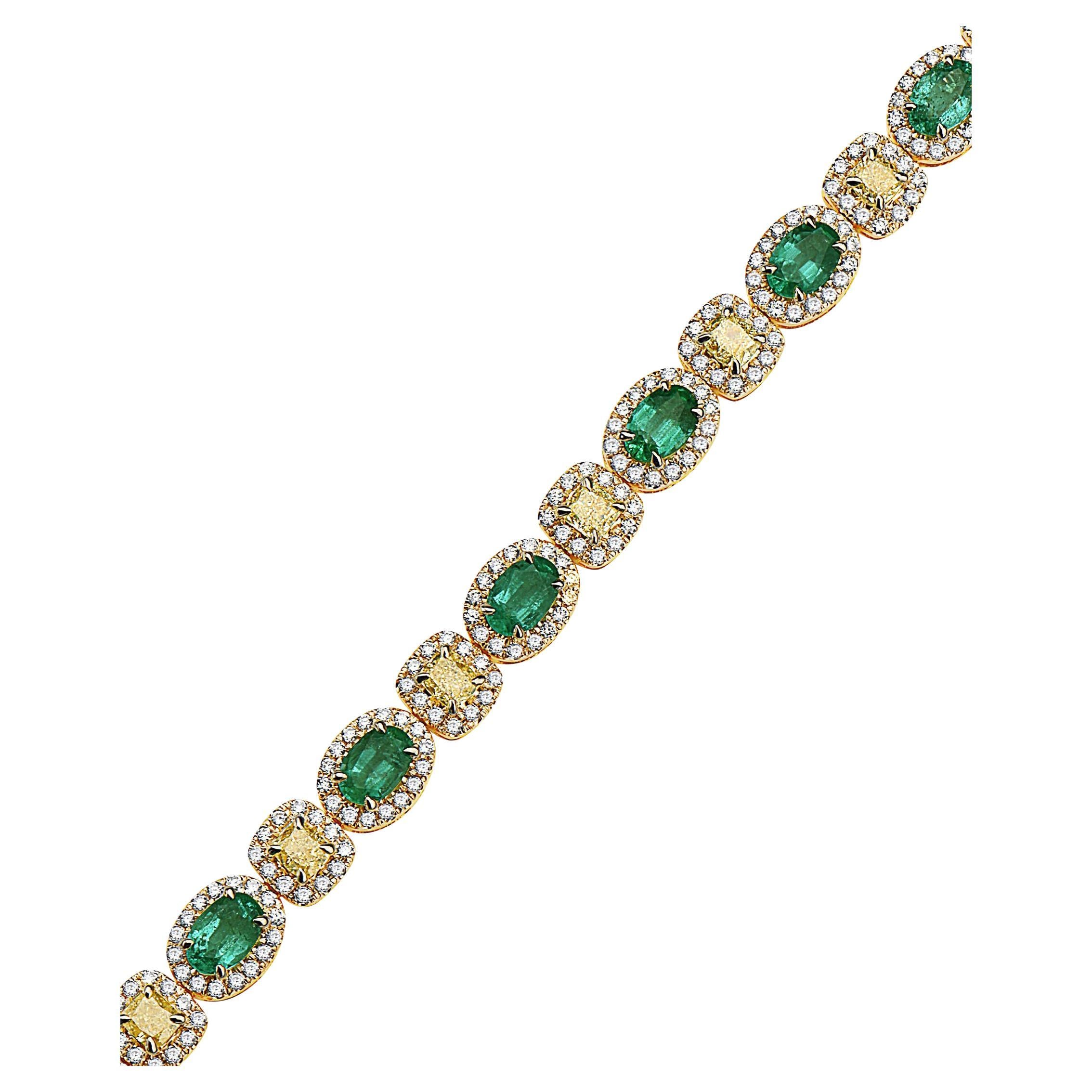This beautiful bracelet features (12) Natural Oval Shaped Emeralds, (12) Natural Fancy Light Yellow Cushion Diamonds weighing approximately 2.88 Carats (SI1-SI2) & approximately 1.90 Carats of Round Brilliant Cut Diamonds Haloing each Emerald &