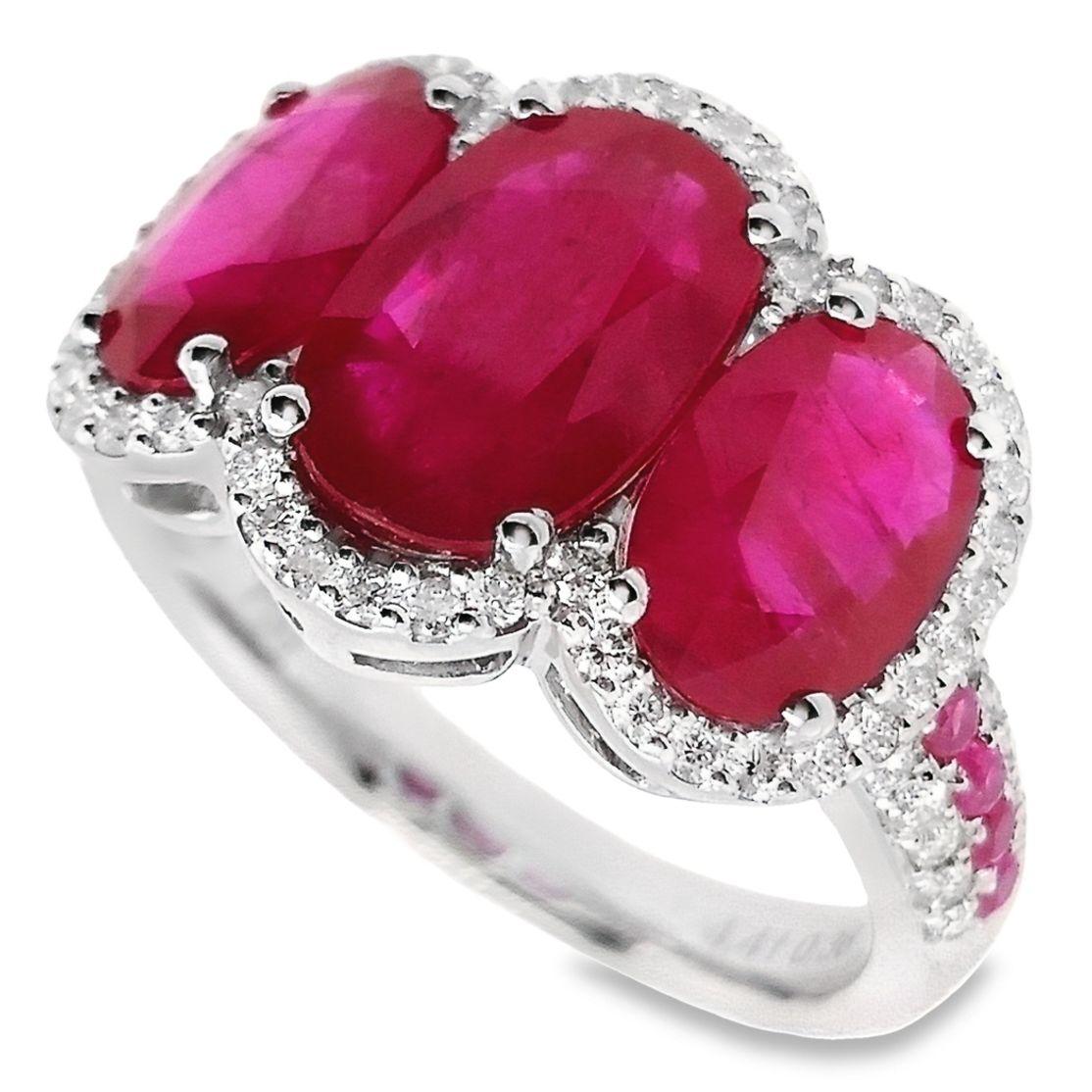 This chic ring, from the house of Top Crown Jewelry collection, is a unique piece of jewelry.
The center stones are natural rubies, oval shape with beautiful deep pink-red color, accented by 100% natural round sparkling diamonds.

This ring is
