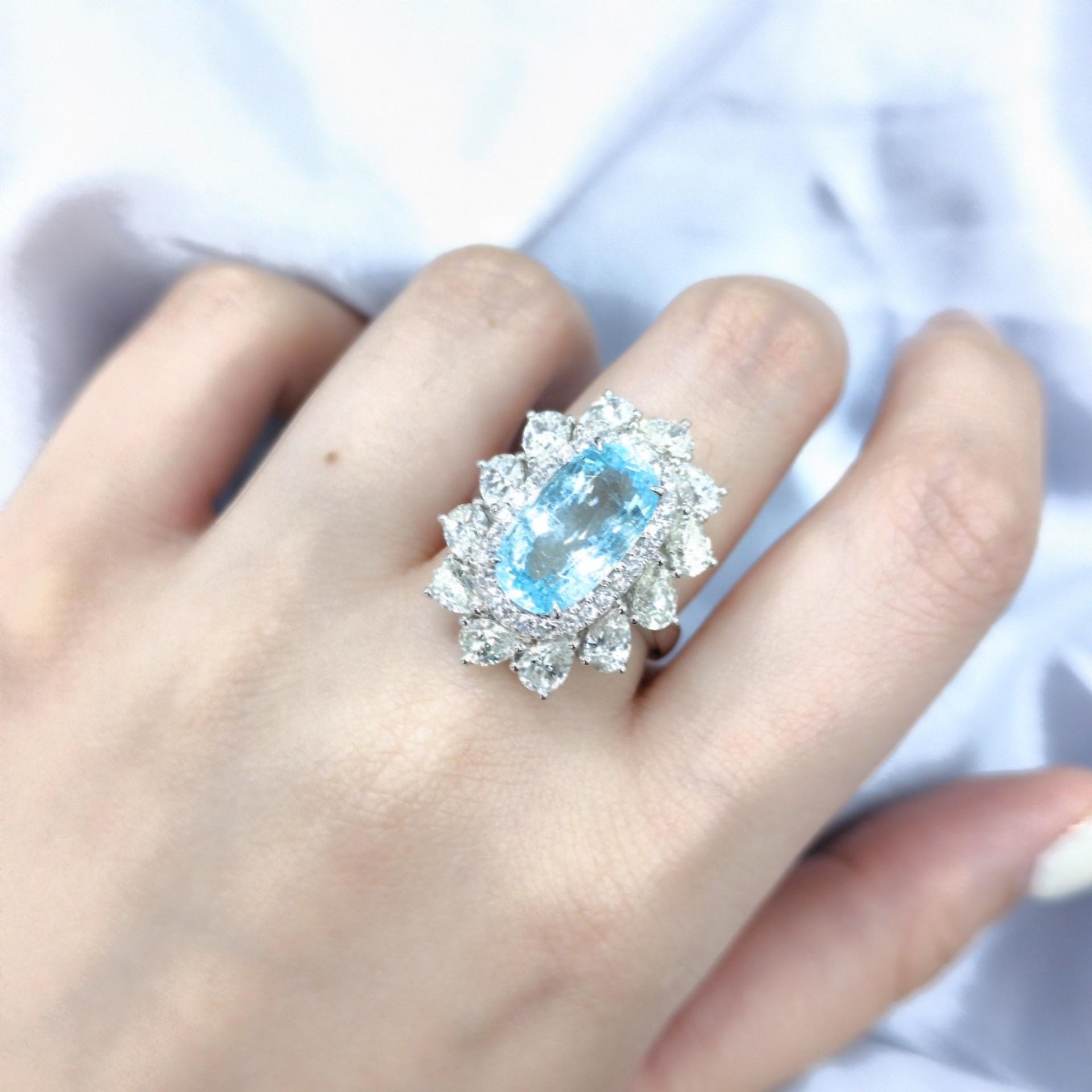 Introducing an exquisite and exceptionally rare piece of jewelry, the IGI Certified 4.67 Carat Natural Parabia and Diamond Cluster Ring. This ring showcases the undeniable beauty of a 4.67 carat natural Parabia, a truly remarkable gemstone known for