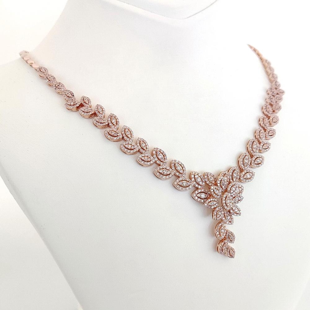 FOR U.S. BUYERS NO VAT 

Made from 14kt pink gold and 844 faint pink endlessly sparkling diamonds totaling 4.67 carats, this mesmerizing necklace with is elegant and gorgeous leaves - like design will be irresistible not to wear with your special