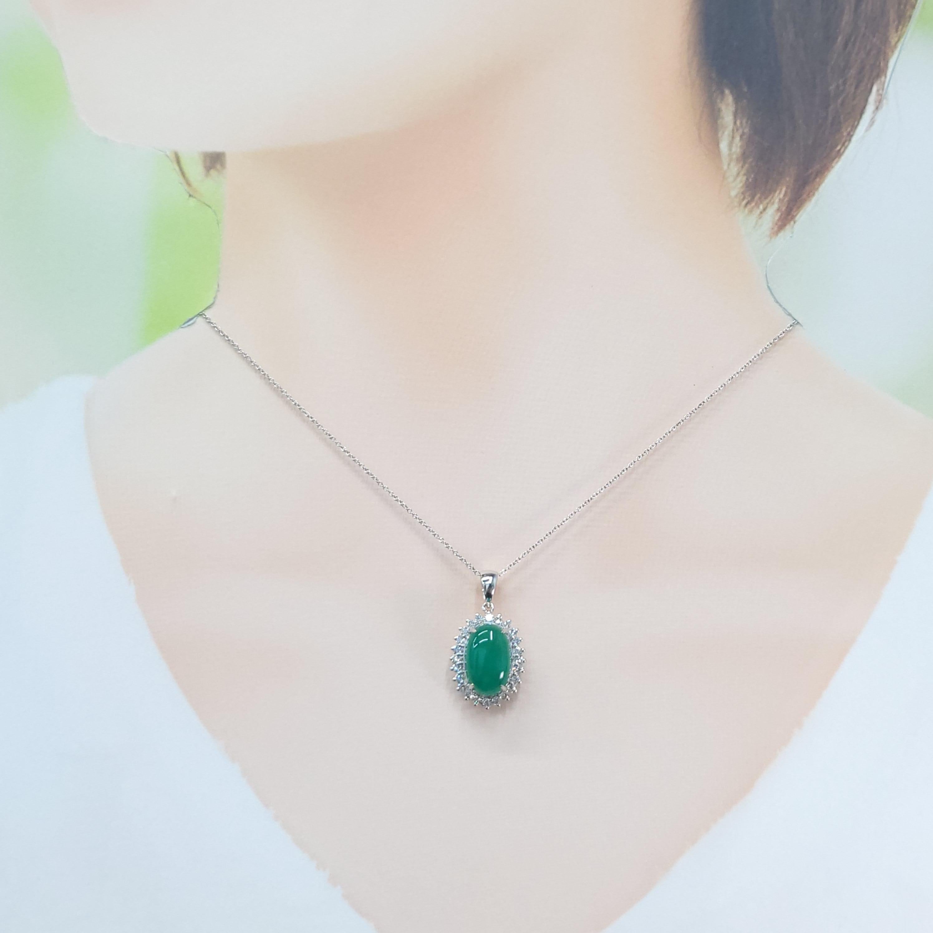 Discover the captivating beauty of this elegant pendant, showcasing a vibrant 4.80 carat natural emerald. The smooth oval cut beautifully displays the gem's rich and intense bluish green hue, a colour that embodies natural elegance and