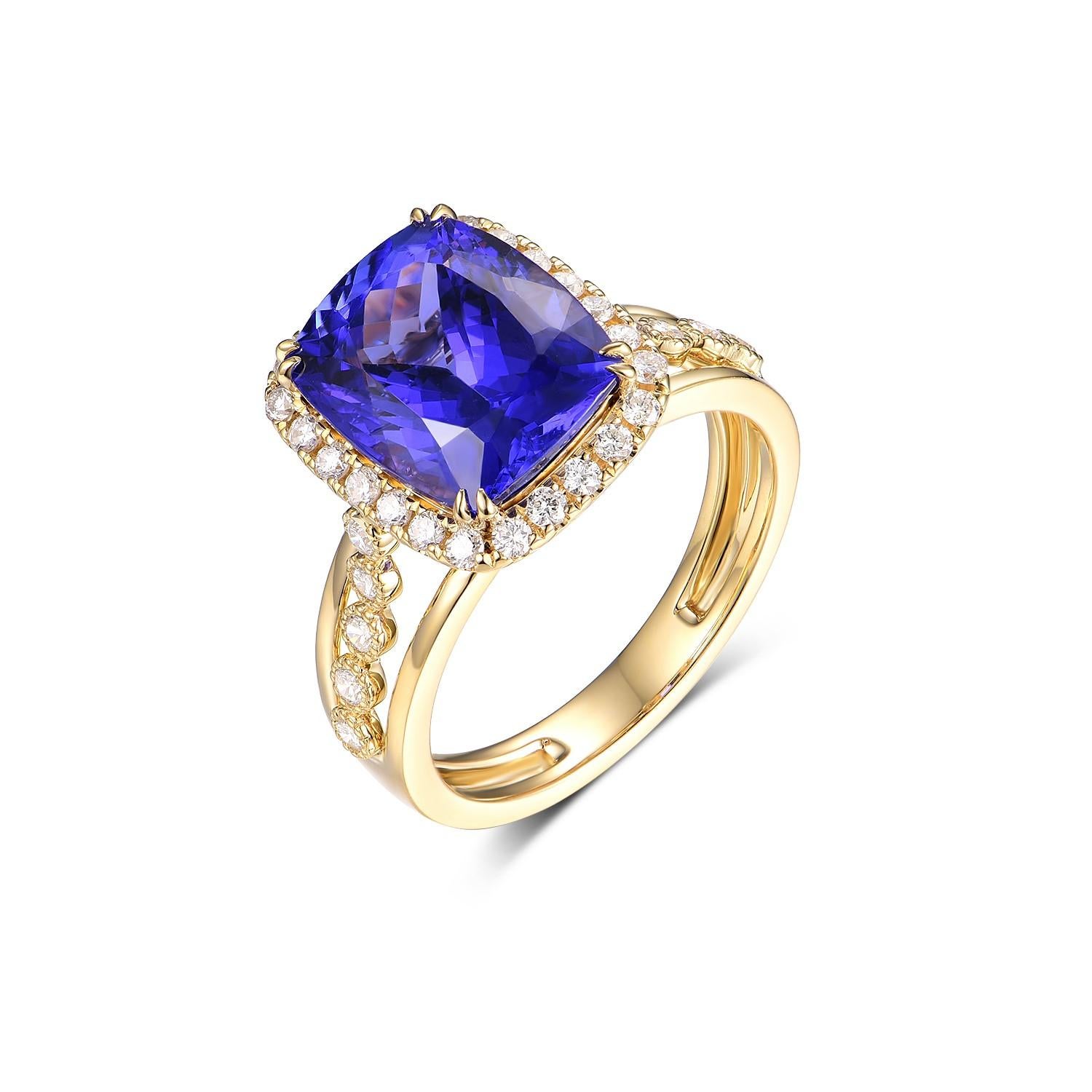 This elegant ring is a celebration of color and craftsmanship, featuring a stunning 5.31 carat Tanzanite as its centerpiece. The Tanzanite's vivid blue and violet hues are beautifully complemented by the rich warmth of the 18 karat yellow gold