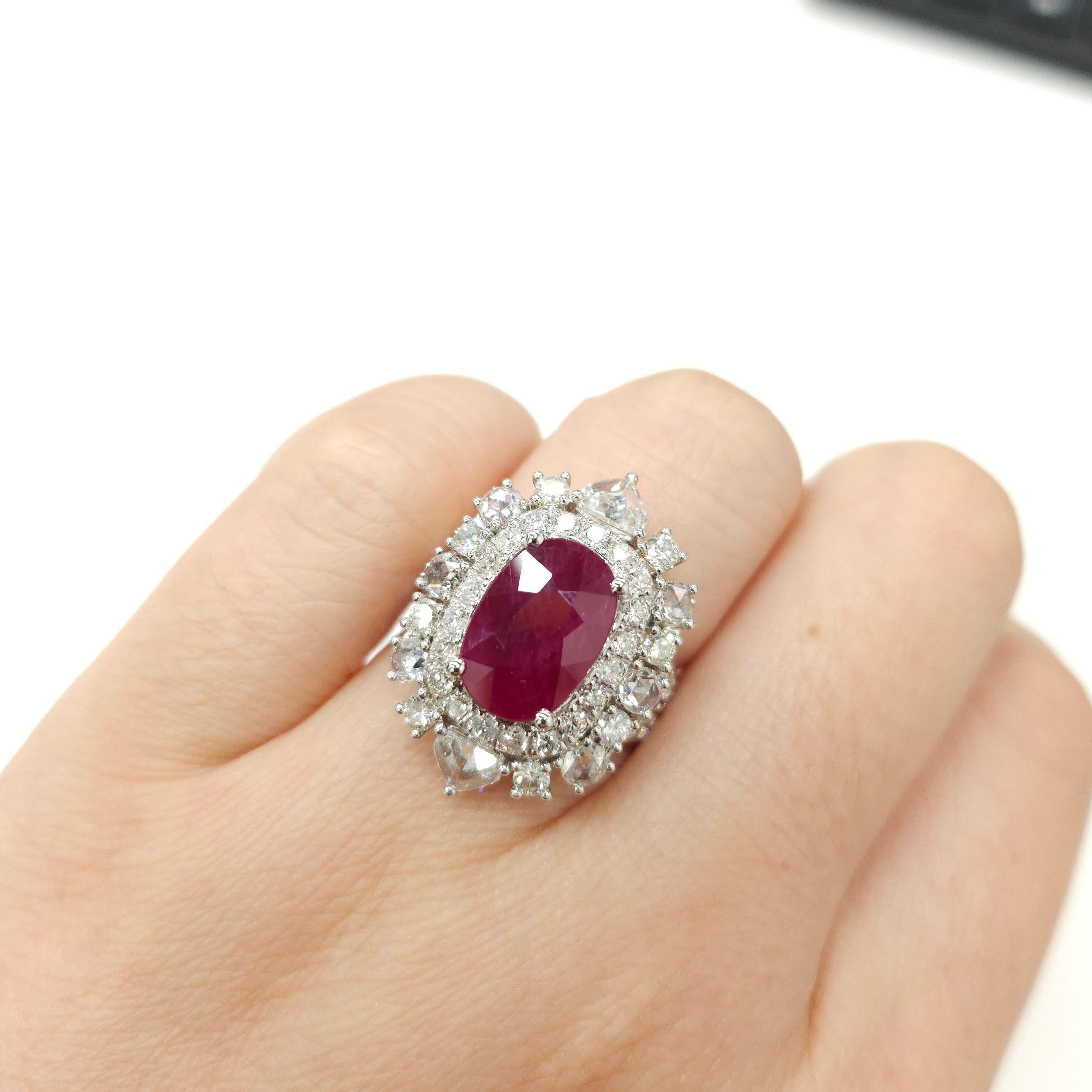 This exquisite ring showcases the rare beauty of a Burmese ruby, accompanied by an array of meticulously cut diamonds. With its IGI report number #34J1840324, this ring guarantees exceptional quality and authenticity.

At the heart of this