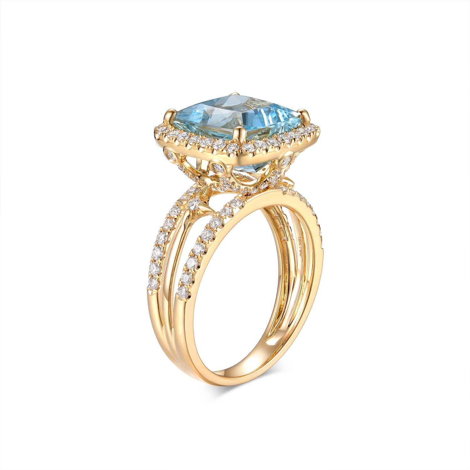 Presenting an opulent masterpiece, this ring is crafted in 18 Karat Yellow Gold and features an exquisite 5.69-carat Aquamarine gemstone. The cushion-cut aquamarine, with its captivating sea-blue hue, takes center stage, embodying a sense of