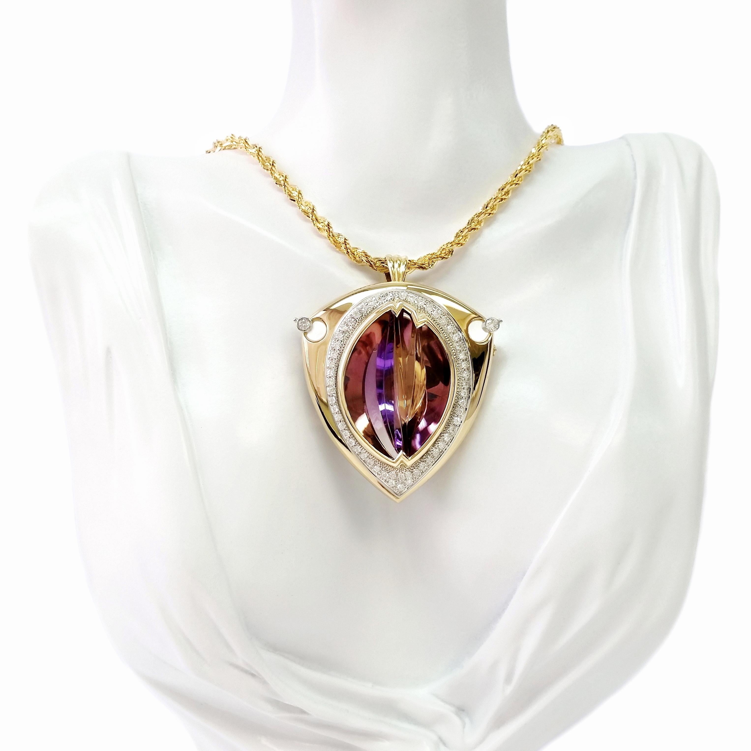 Experience the pinnacle of luxury with our Top Crown Jewelry versatile and opulent brooch/necklace, expertly crafted in platinum and 18K yellow gold. This magnificent piece features a regal 57.07ct IGI Certified Natural Purple Amethyst, elegantly