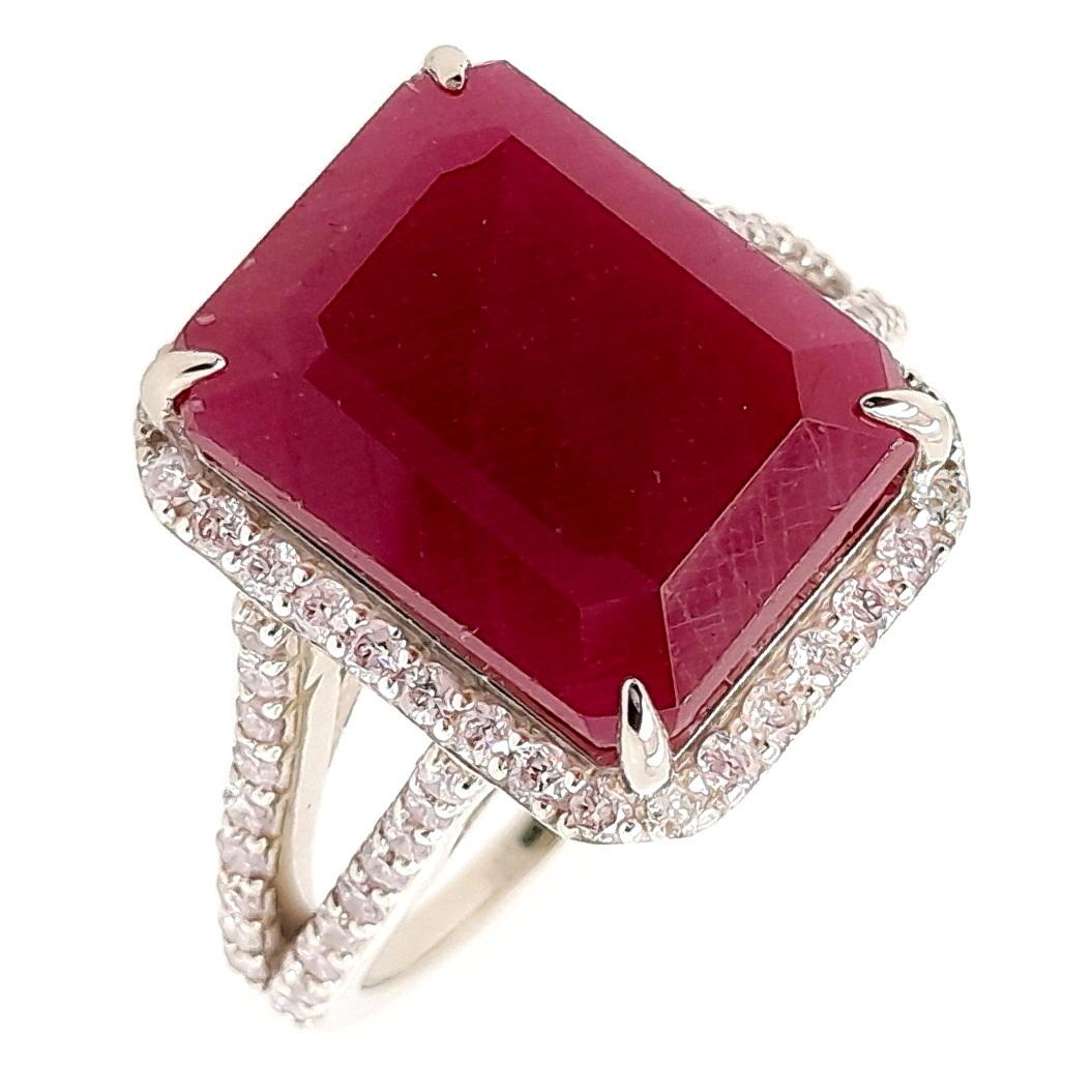 This chic ring, from the house of Top Crown Jewelry collection, is a unique piece of jewelry.
The centre stone is a natural ruby without treatment, emerald shape with beautiful deep purplish red color, accented by 100% natural round sparkling