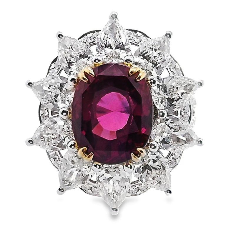 Immerse yourself in luxury with this extraordinary 18K yellow and white gold ring, featuring a magnificent 6.03-carat Burma ruby in a skilfully crafted oval mixed-cut. This stunning gem boasts fine colour quality as certified by IGI and takes centre
