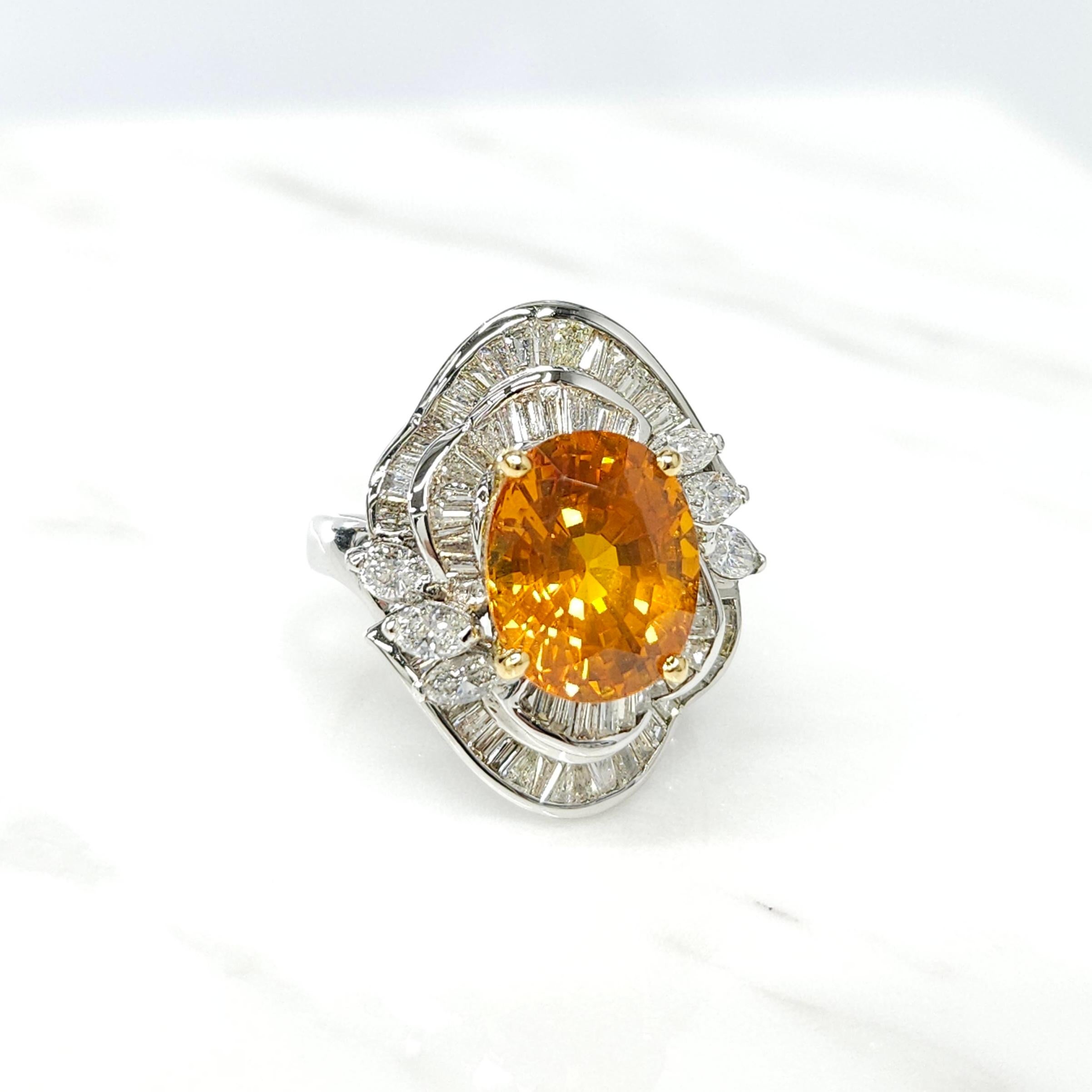 e IGI certified 18K white gold rare 6.08 Carat orange sapphire diamond ring is a truly remarkable piece of jewelry. The oval-shaped orange sapphire,originated from Sri Lanka, boasts a vivid yellowish orange color that is both captivating and unique.