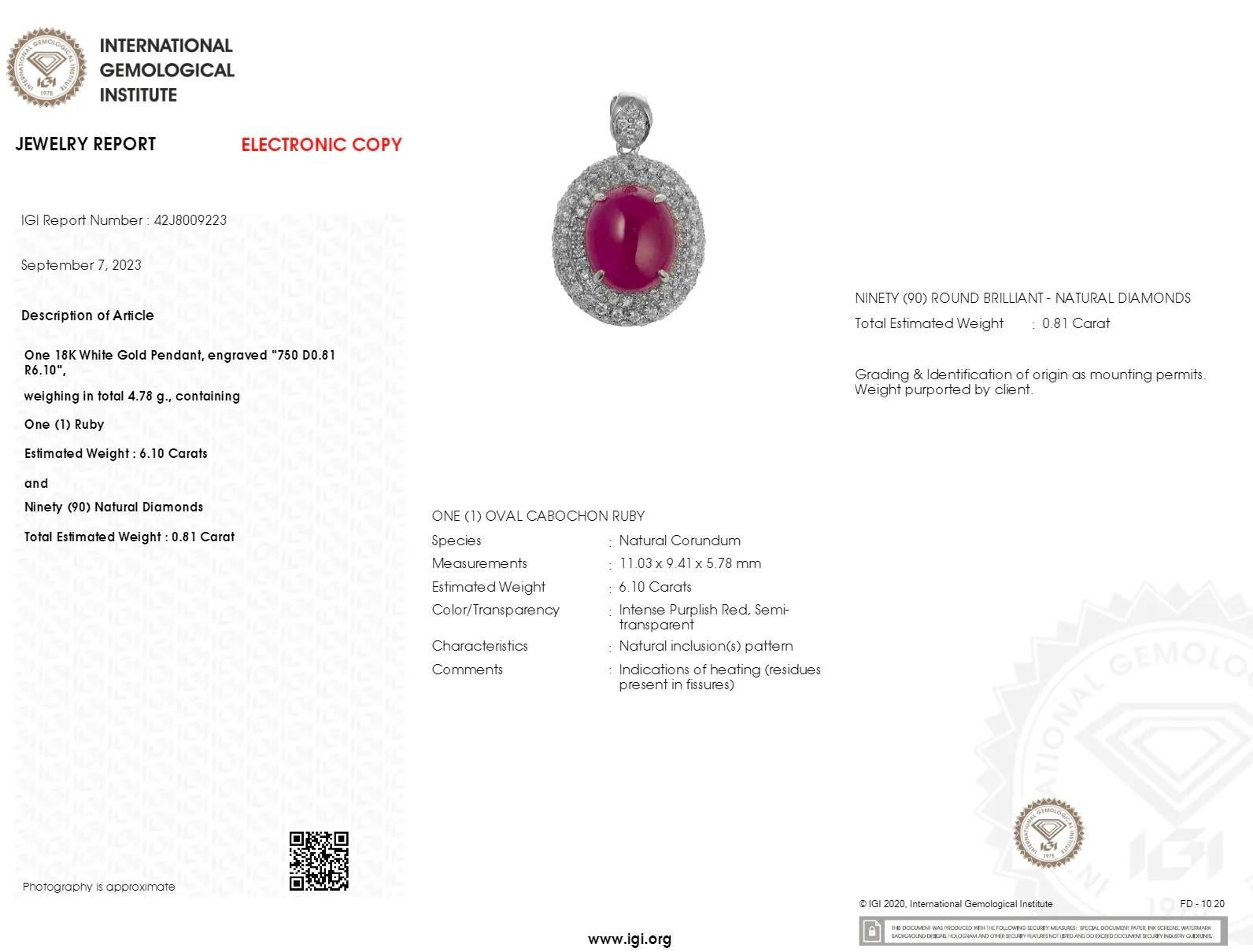Indulge in the vibrant elegance of this exquisite pendant, showcasing a magnificent 6.10 carat natural ruby. The classic oval cut beautifully displays the gem's rich and captivating intense purplish red hue, a colour that embodies passion and