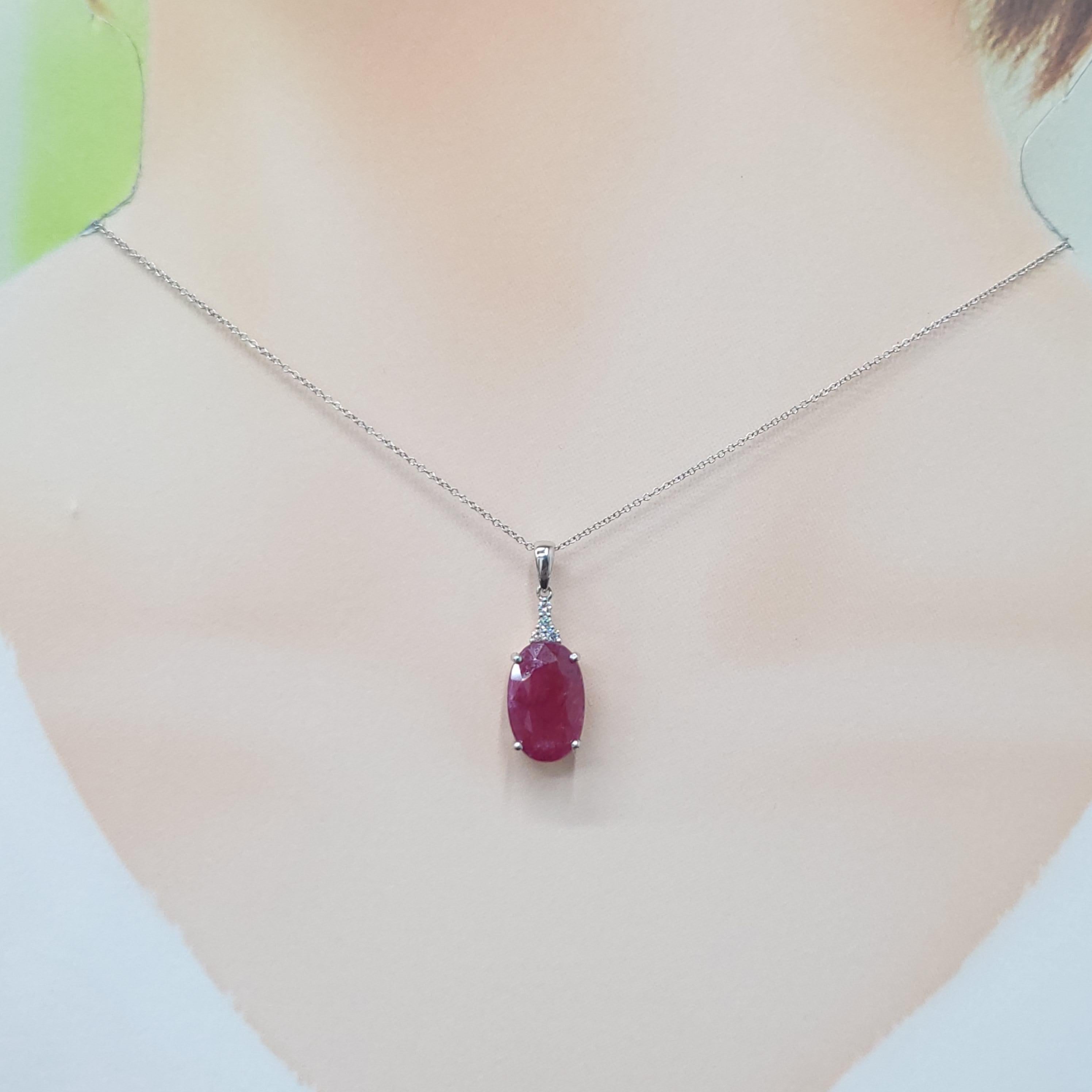 Ignite your passion with this captivating pendant, showcasing a magnificent 6.16 carat natural ruby. The elegant oval mixed cut enhances the gem's rich, fiery red hue, allowing light to dance across its facets with breathtaking brilliance. This