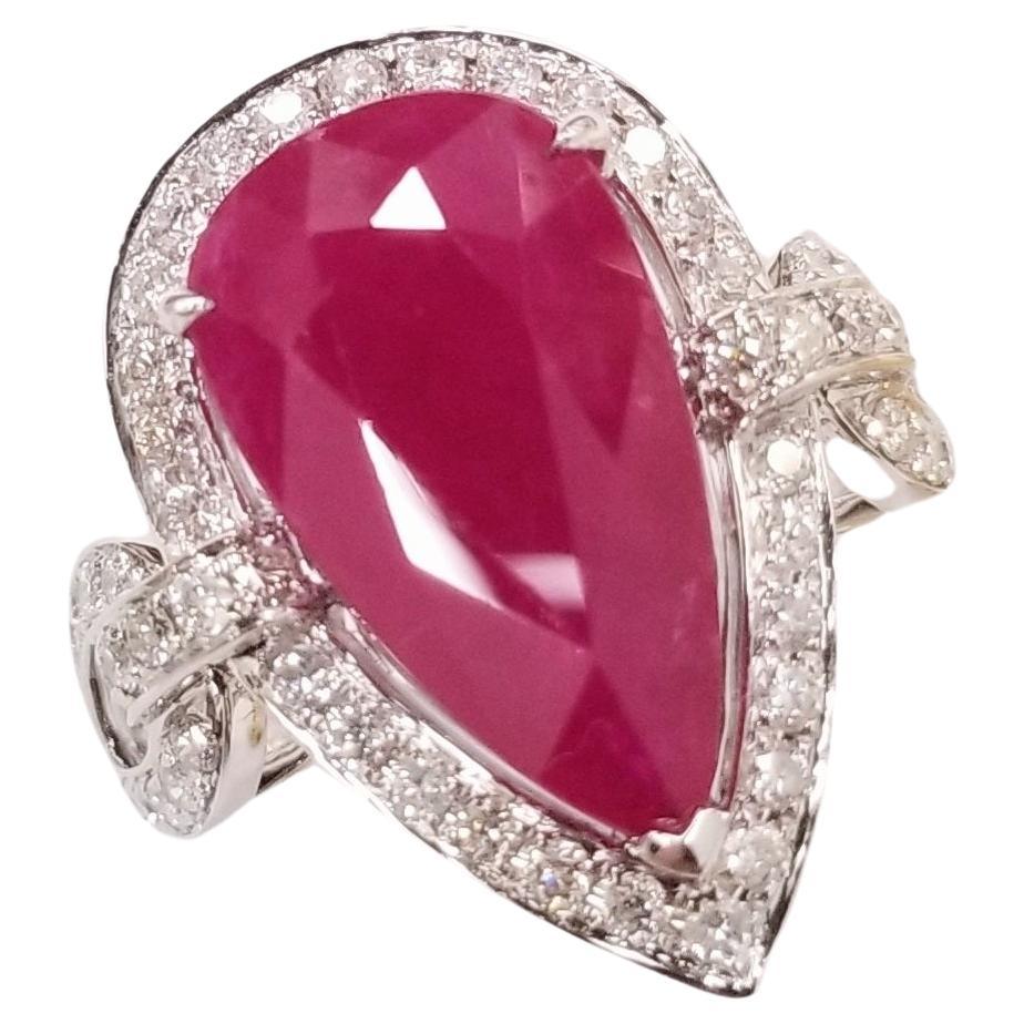 This remarkable ring boasts a rare and exceptional long pear-shaped Burmese ruby, adorned with dazzling diamonds. The IGI report ensures the authenticity and quality of this stunning creation.

The centerpiece of this ring is the magnificent 6.45