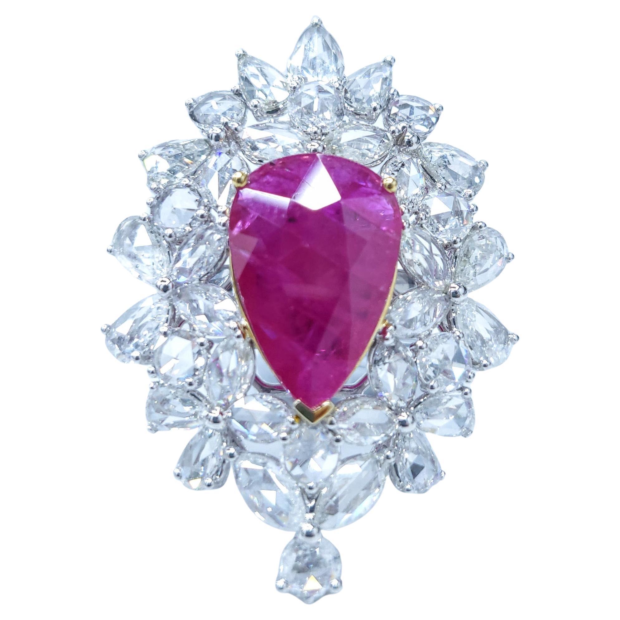 Introducing the breathtaking IGI Certified 6.72 Carat Ruby Diamond Ring Pendant 2-way in 18K White Gold, a true masterpiece of luxury and versatility. This extraordinary piece showcases a single pear-shaped Colombian emerald in an intense red color,