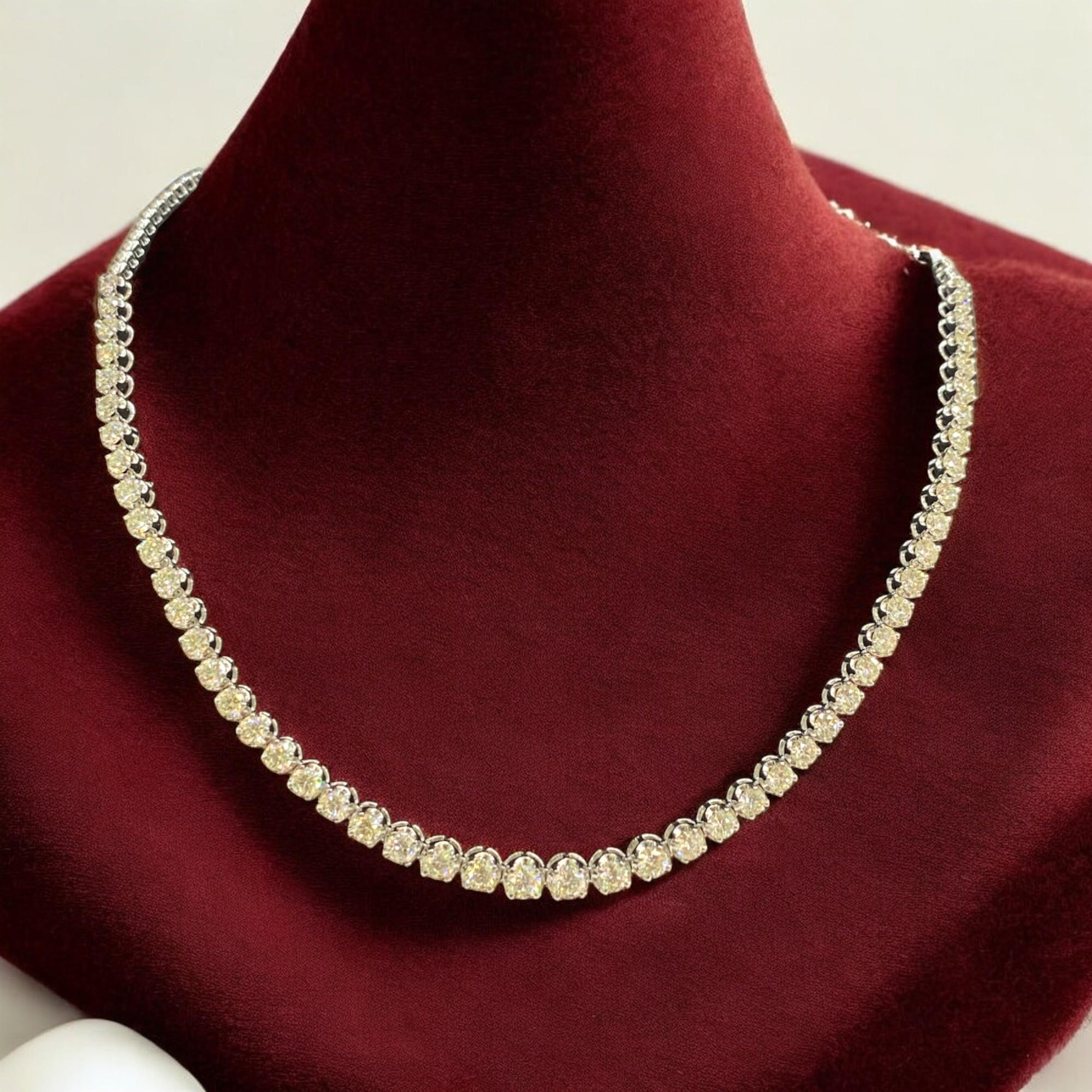 6.72 Cts Round Brilliant Cut Graduated Diamonds Mid Half Tennis Necklace in 14K White Gold. This stunning necklace features 51 dazzling white diamonds with a total carat weight of 6.72. The diamonds are F colour grade and VS1 clarity grade, set in a