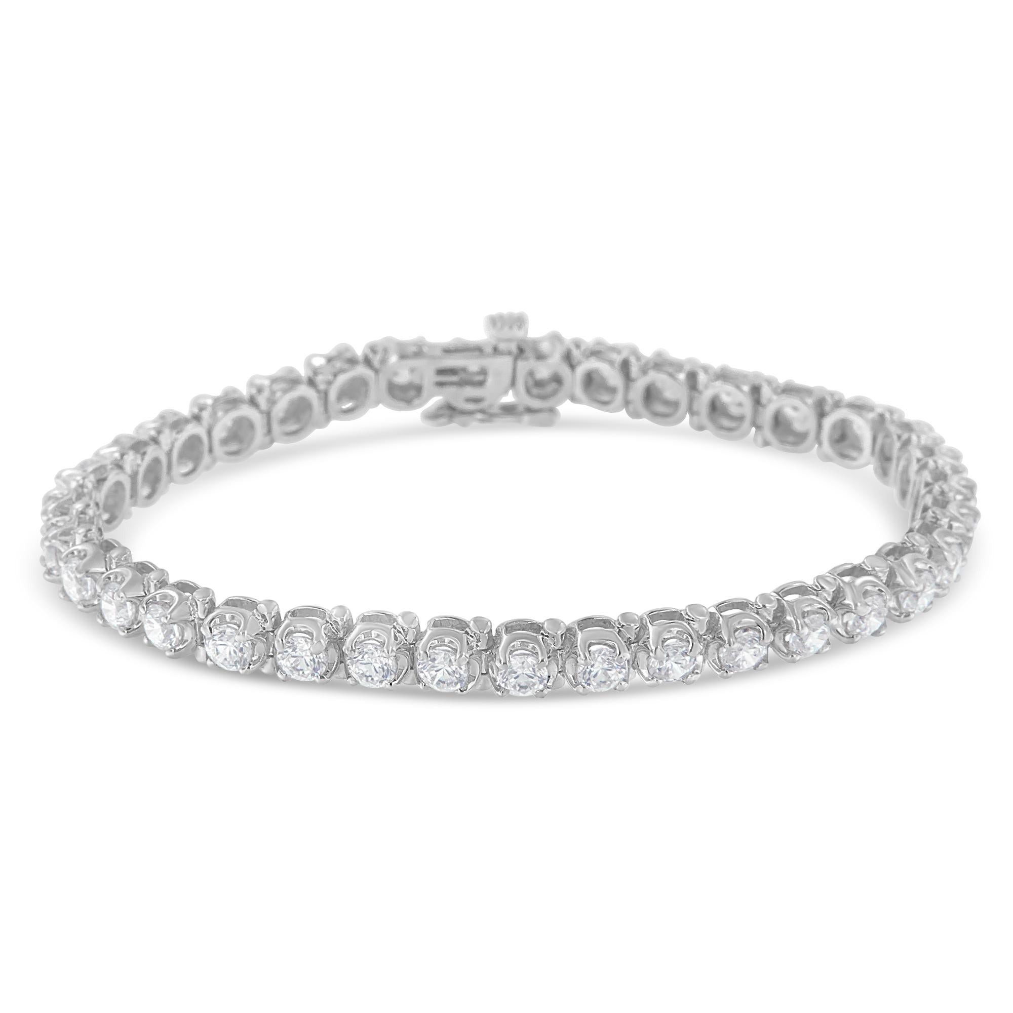 A must have for any serious jewelry collection, this breathtaking 14k white gold tennis bracelet boasts an impressive 7 ct total diamond weight. Embellished in an elegant prong setting sits 35 round-cut, natural diamonds. This is the perfect