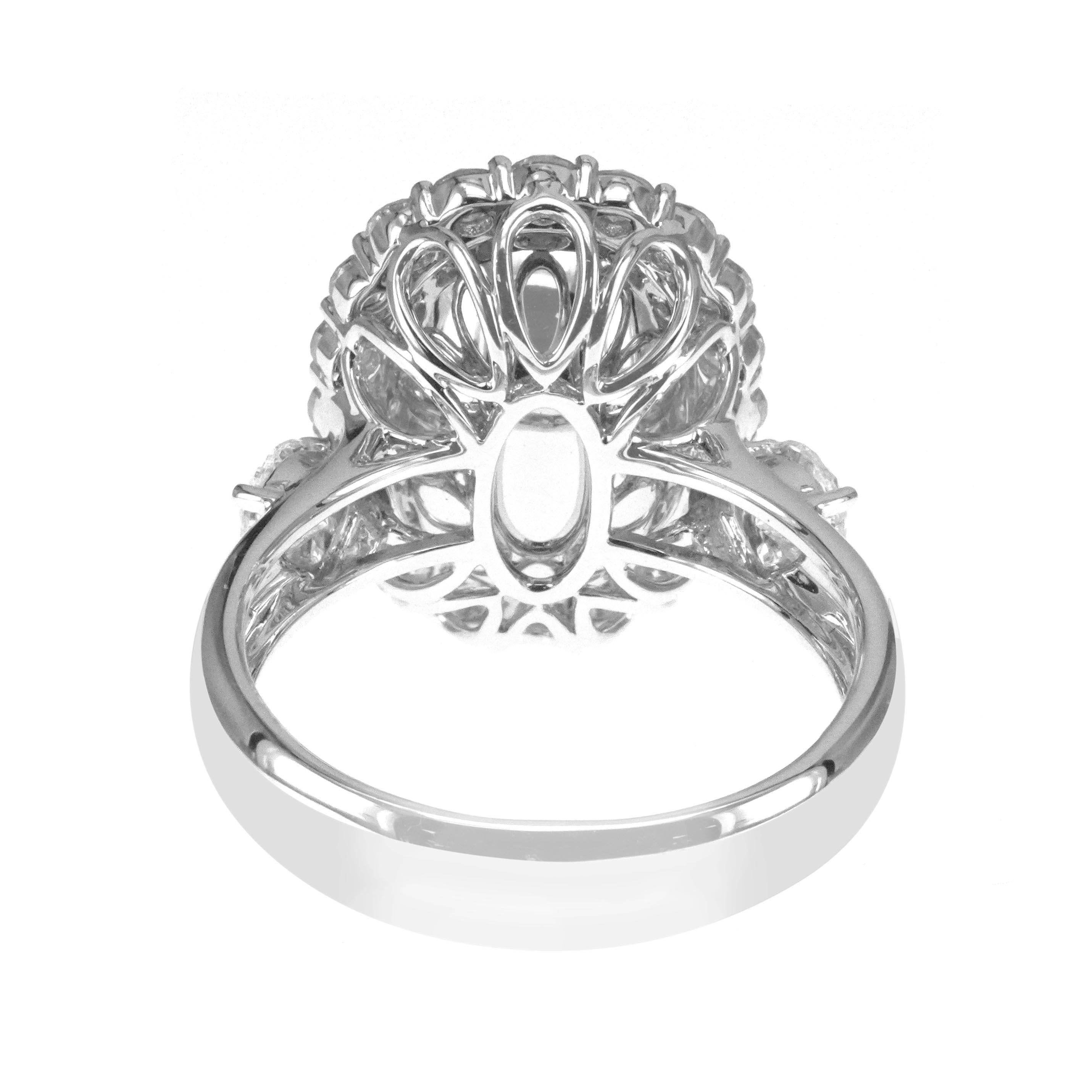 Oval Cut IGI Certified 7.15 Carat Emerald 1.58 Carat White Diamond Solitaire 18k Ring For Sale