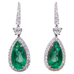 IGI Certified 7.26 Carat Pear Shape Green Emerald 18K White Gold Drop Earrings