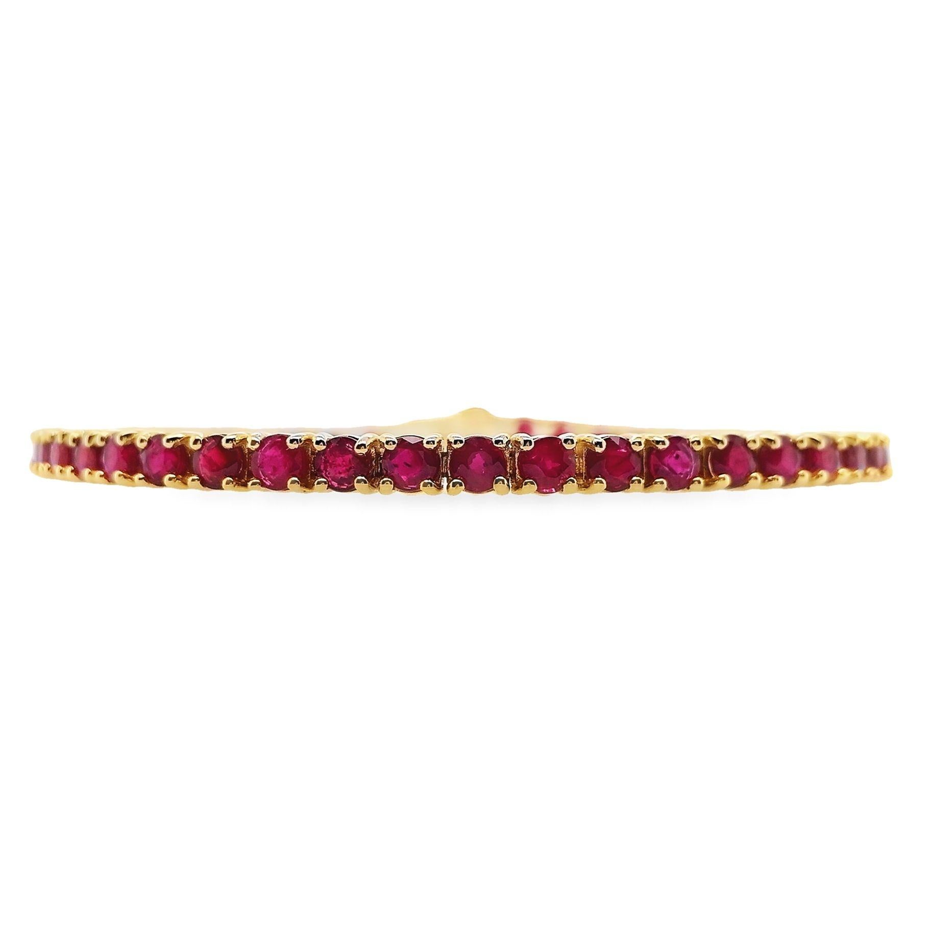 Indulge in timeless elegance with this exquisite 14kt yellow gold bracelet, featuring 48 meticulously selected natural rubies totalling 7.27ct in captivating intense to deep purplish-red hues. Each round mixed-cut gem creates a symphony of luxury