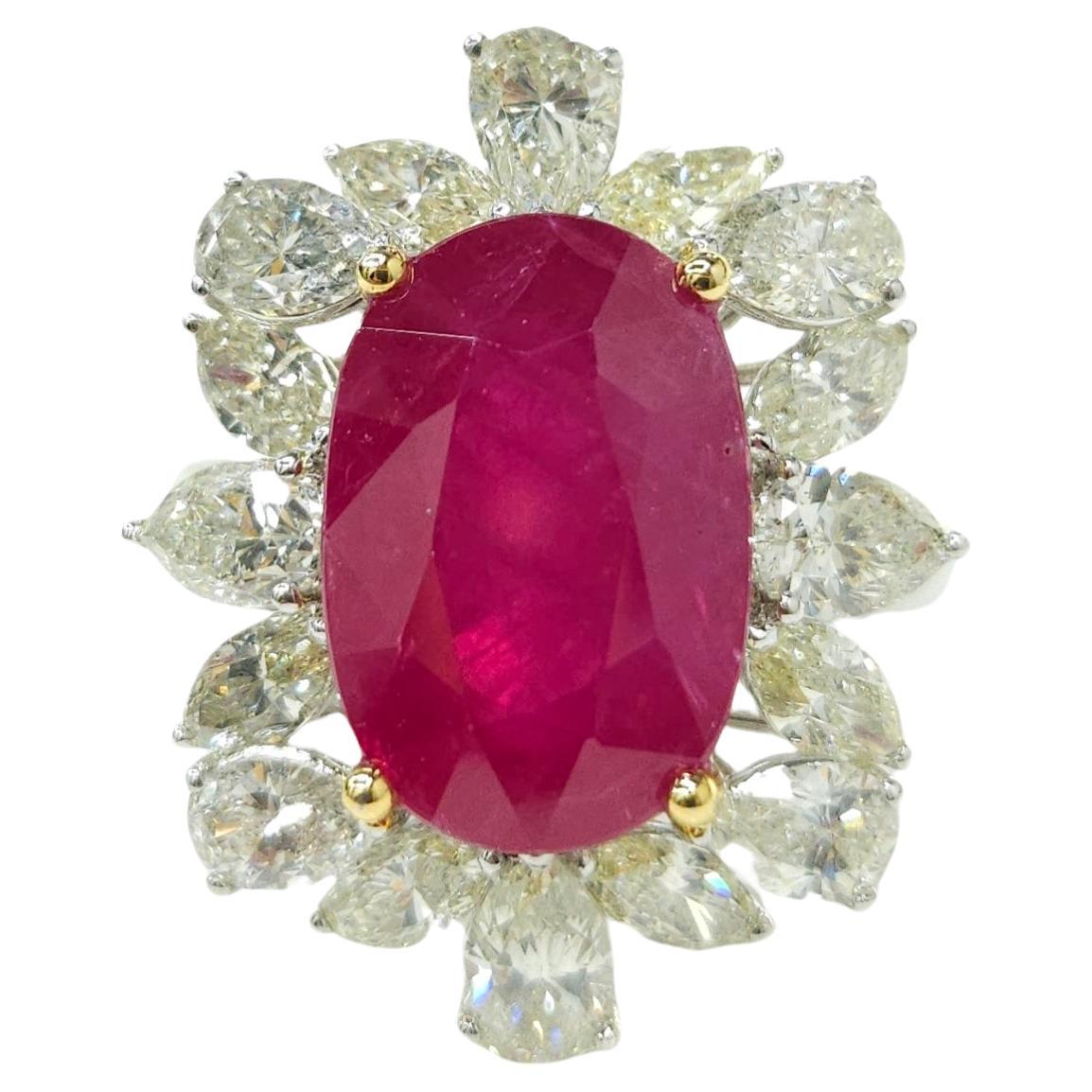 Prepare to be captivated by a truly exceptional piece of fine jewelry – an 18K white gold ring that showcases an extraordinary IGI-certified 8.31-carat Burmese ruby of the rarest and most coveted vivid pinkish-red color, accompanied by a stunning