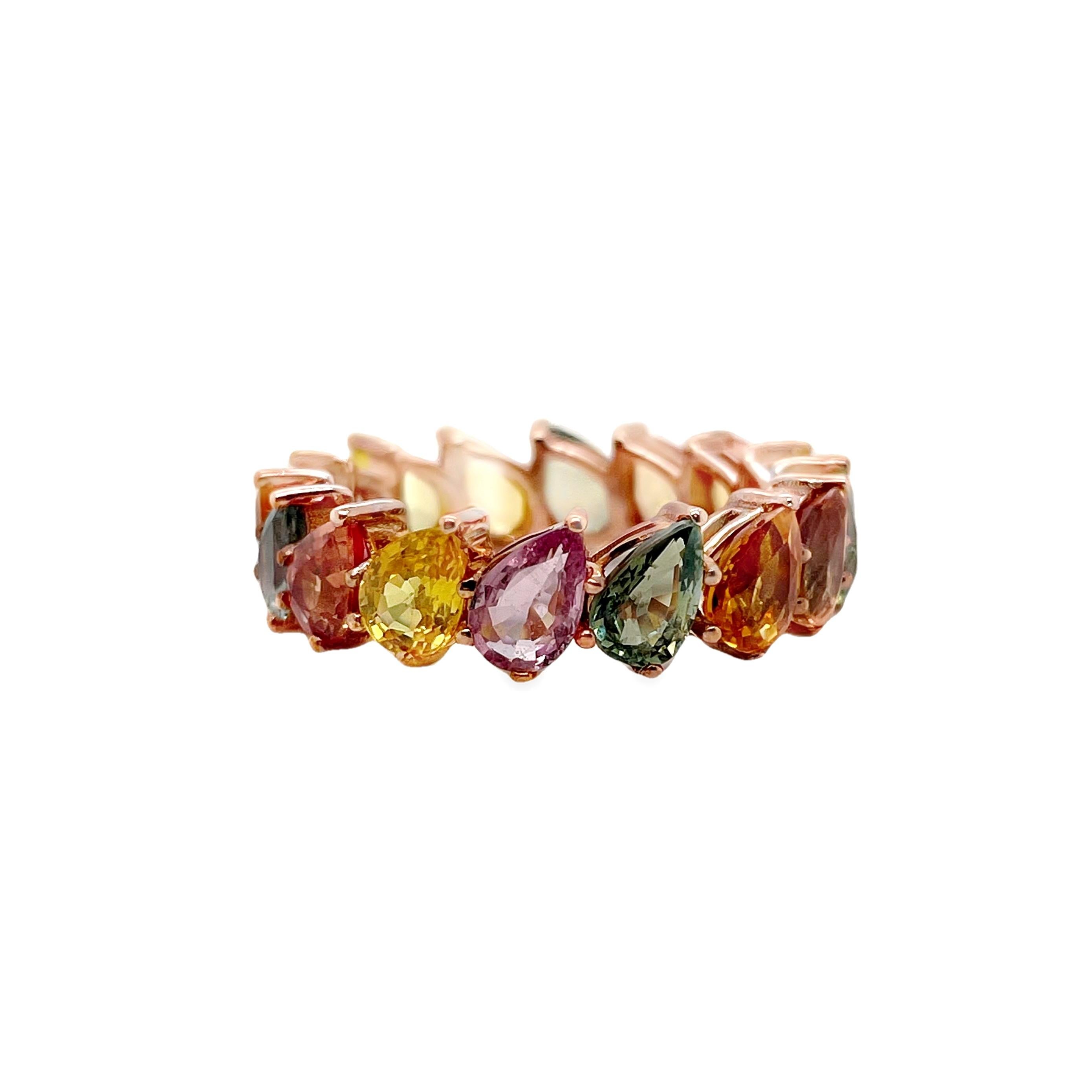 A stunning composition of pear-mixed cut natural sapphires, totaling 8.43 carats, beautifully set in a lavish 14K pink gold ring. This arrangement captures the allure of varied colors, creating a truly captivating and sophisticated piece by Top