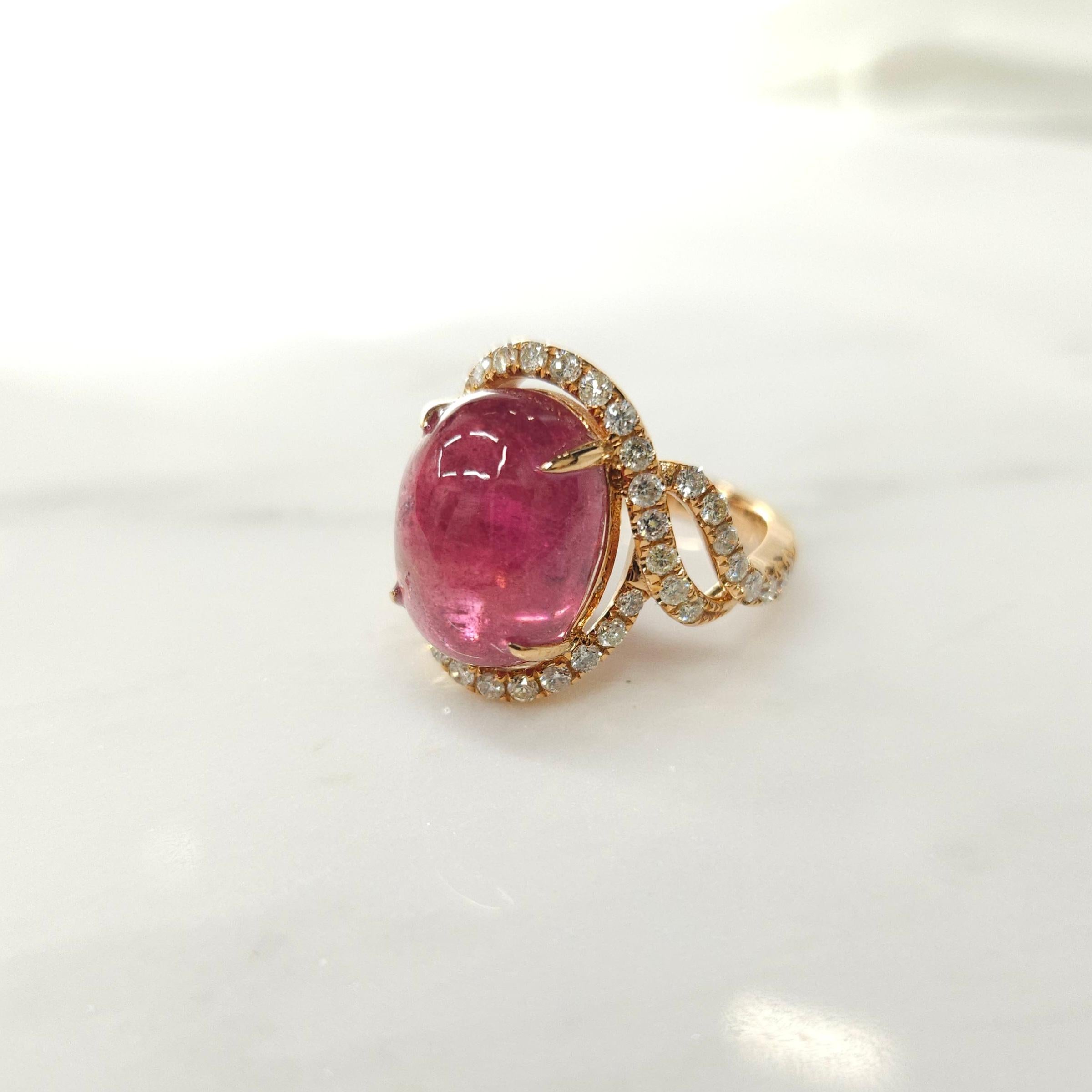 Introducing a breathtaking piece of jewelry featuring a dazzling IGI Certified 9.10 Carat Tourmaline in a striking intense purplish pink color. The oval-shaped tourmaline takes center stage in this modern style ring crafted from 18K White Gold and