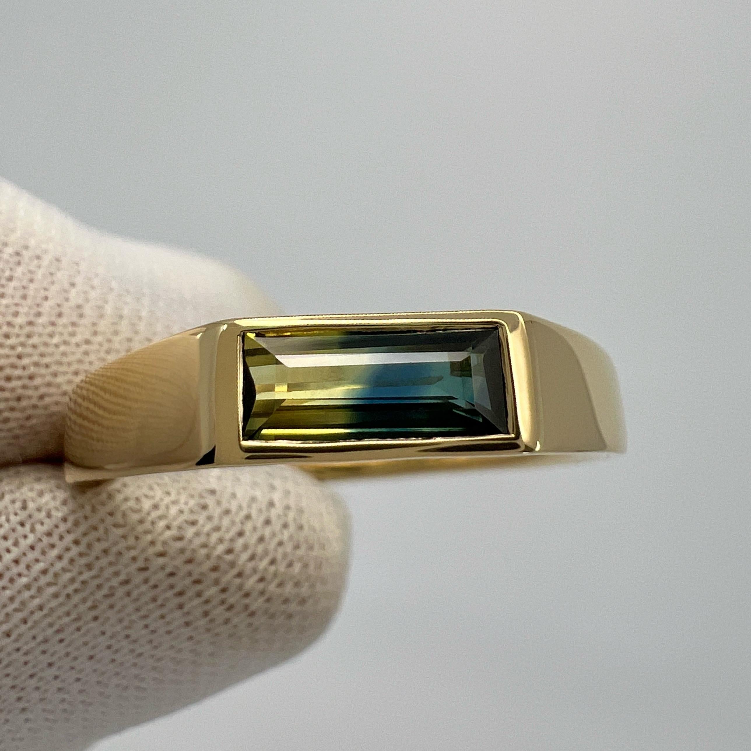 Unique Natural Bi Colour Blue & Yellow Sapphire 18k Yellow Gold East West Rubover Bezel Solitaire Ring.

IGI Certified 0.64 carat sapphire with a unique blue and yellow bi colour effect. Unique and vivid colour gem with perfect colour split.
This