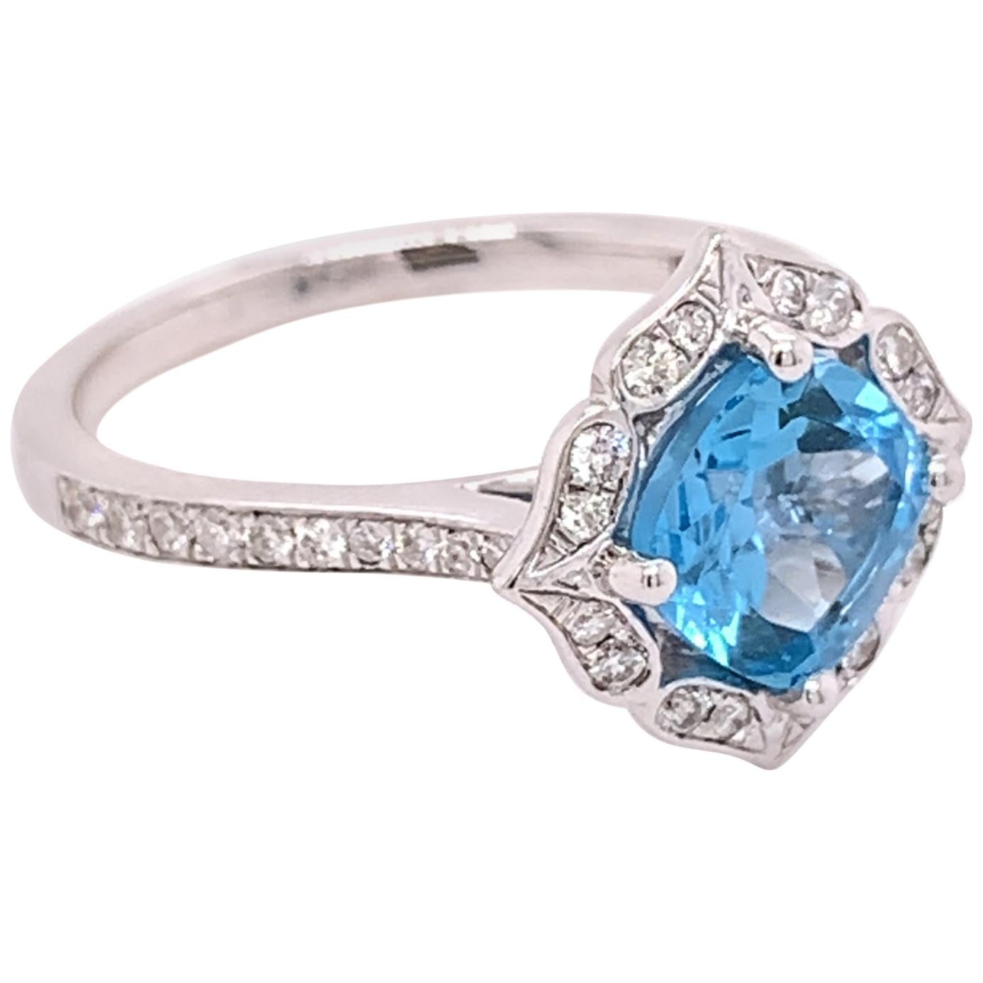 Bague en or blanc 14 carats avec topaze bleue certifiée IGI et diamants