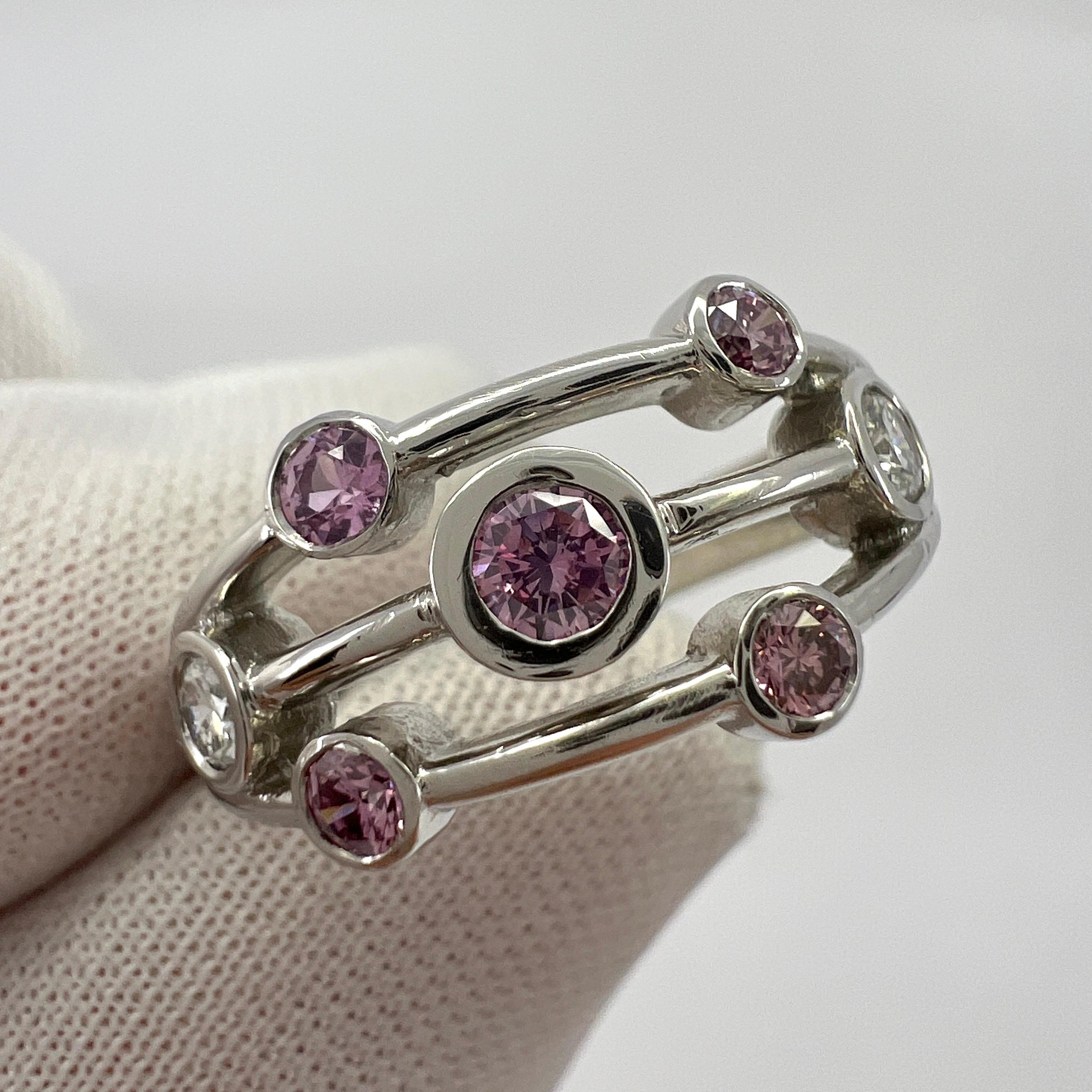 Fine And Rare Untreated Natural Fancy Pink And White Diamond 18k White Gold Raindance Bubble Ring.

A beautiful handmade 18k white gold ring set with 5 round brilliant cut natural fancy pink diamonds and 2 round brilliant cut natural white diamonds.
