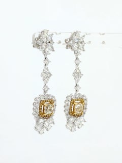 Orecchino a goccia con diamante giallo Fancy certificato IGI in oro bianco 18 carati