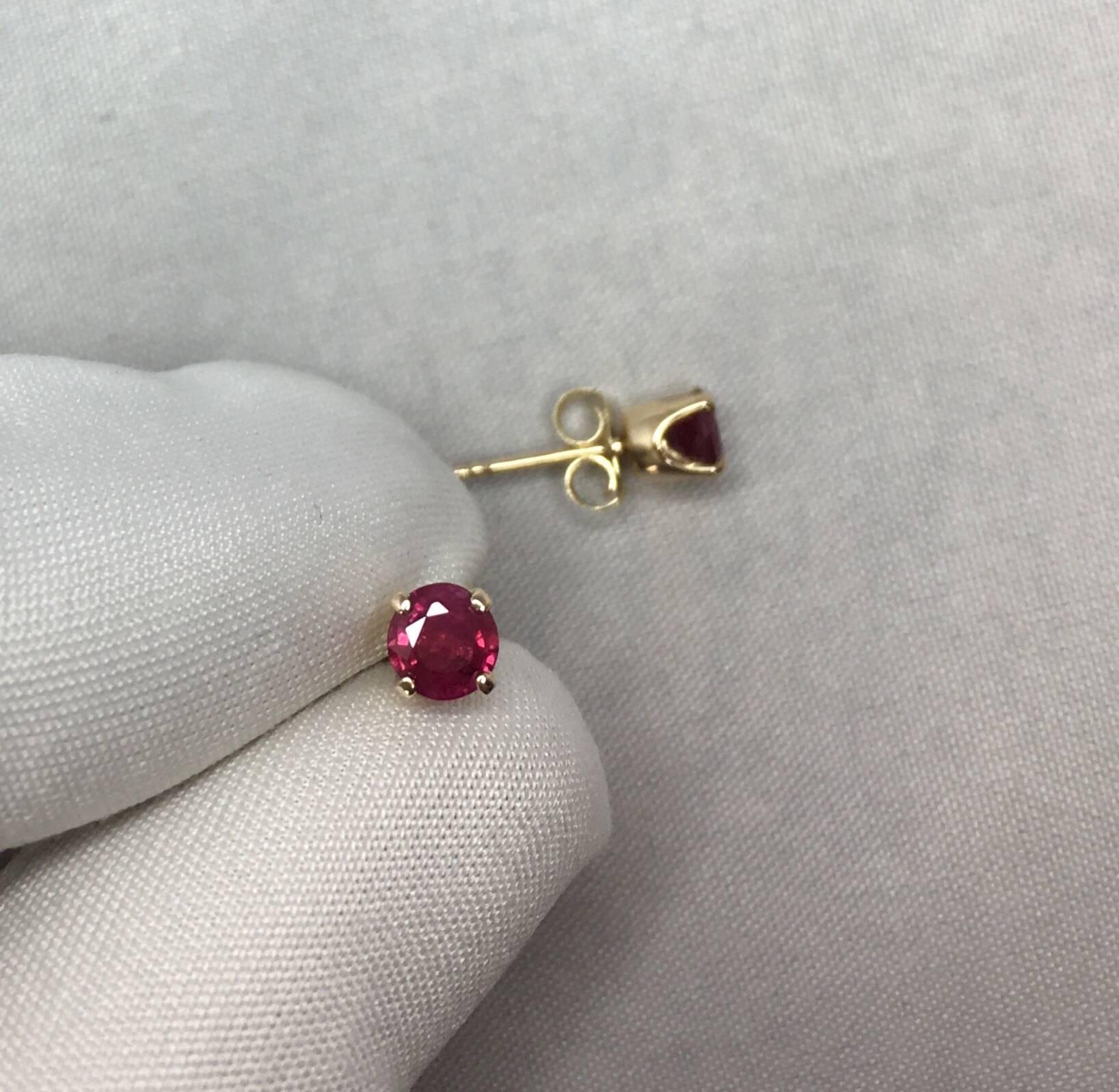 Stunning natural deep red ruby earring studs.

Very rare and fine Ruby pair. 
Deep red colour, both individually certified by IGI Antwerp as natural and Burmese in origin. 

Burmese/Myanmar rubies need no introduction. For centuries they have been