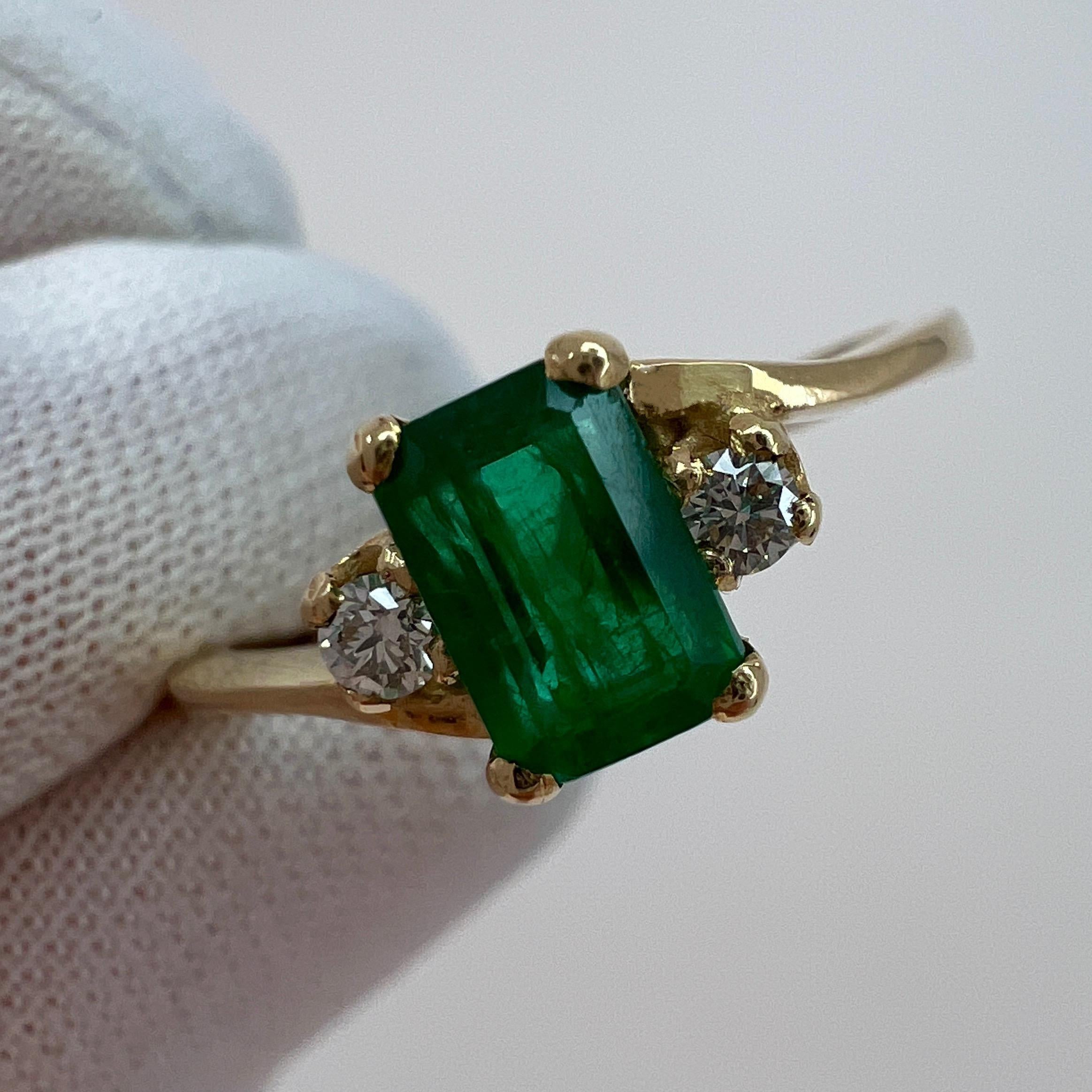 Deep Green Emerald & Diamond Three Stone Yellow Gold Ring.

IGI Certified 0.73 carat emerald with a stunning deep green colour and good clarity. Some inclusions visible, as to be expected with natural emeralds, but not a dirty stone.

Fully