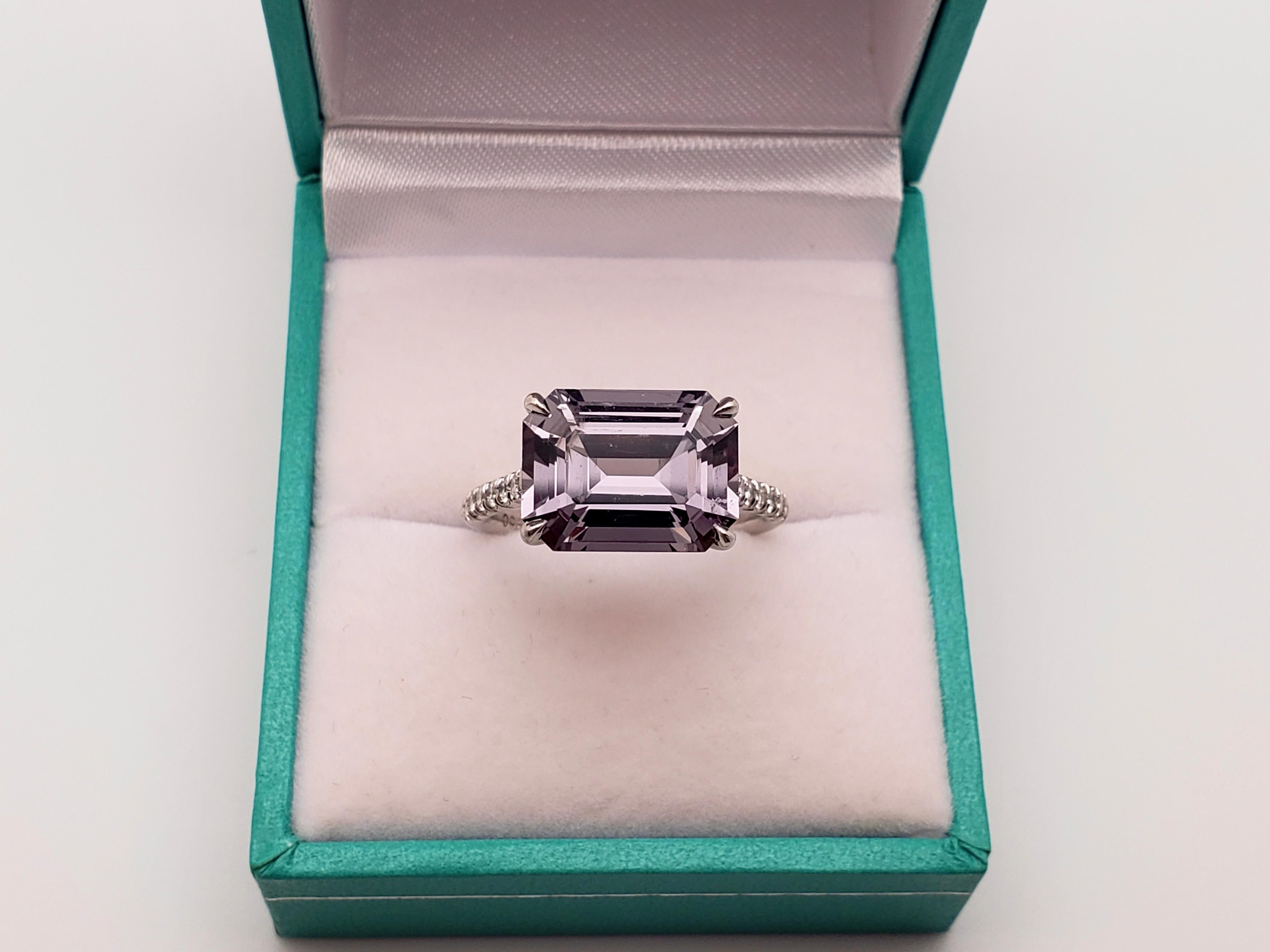 An extraordinary handmade Irina Ferry platinum natural spinel and diamond designer ring. Centered with one natural rectangular cut spinel of vivid violet color, showing a deep midnight blue tone reminiscent of a summer night sky, weighing