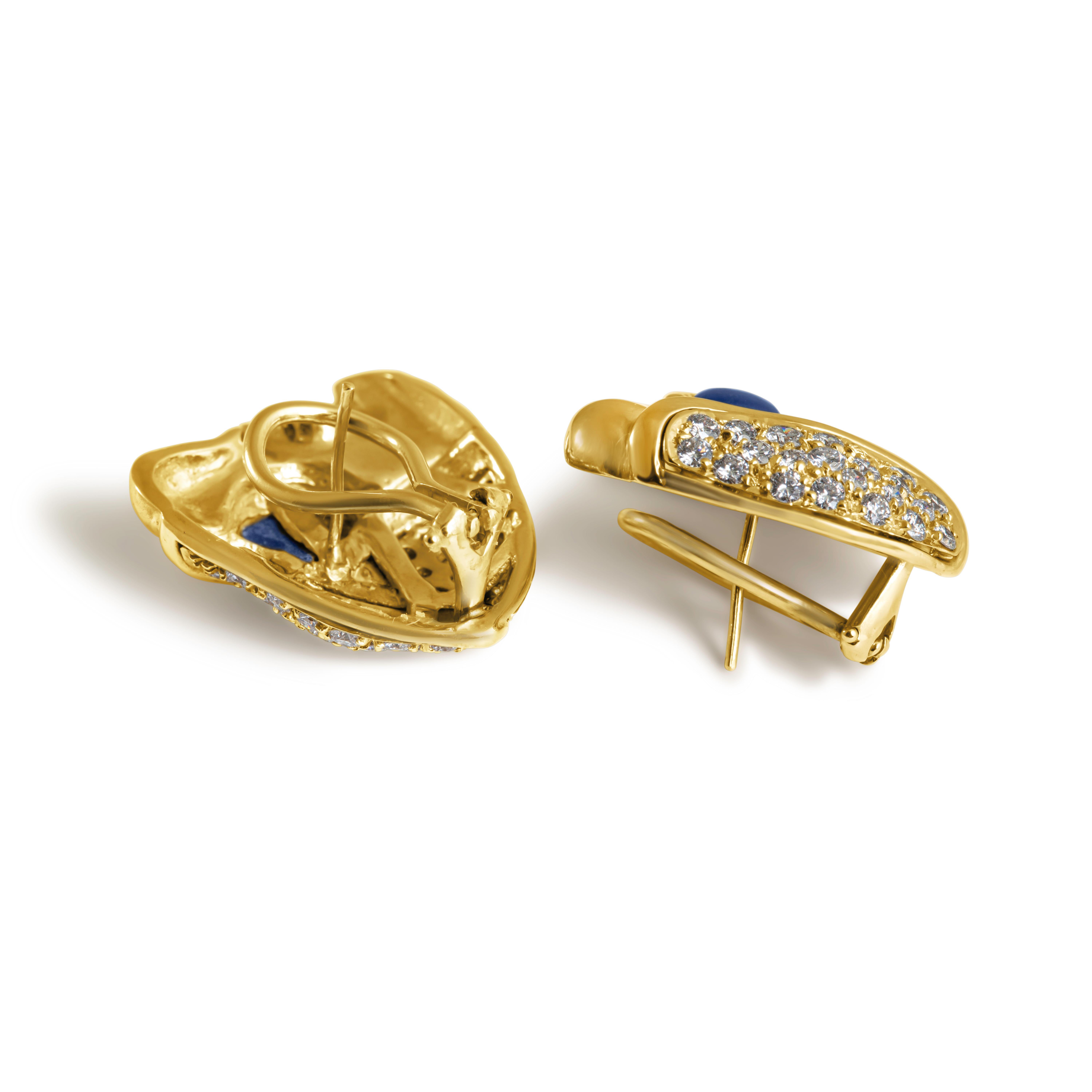 A fabulous estate pair of flower stud earrings with a bold presence and incredible sparkle. Beautifully rendered in gleaming 18ct gold, the earrings feature an abstract lily of the valley in bloom and sit very comfortably on the ear, creating a