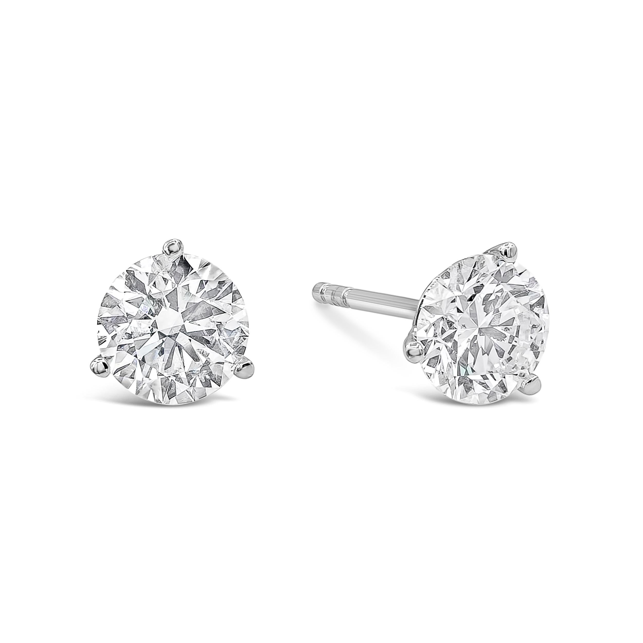 A classic martini style stud earrings showcasing two round brilliant diamonds weighing 1.52 and 1.56 carats respectively, martini set in 14 karat white gold. Diamonds are certified by IGI as G color, SI1 clarity. 

Style available in different price