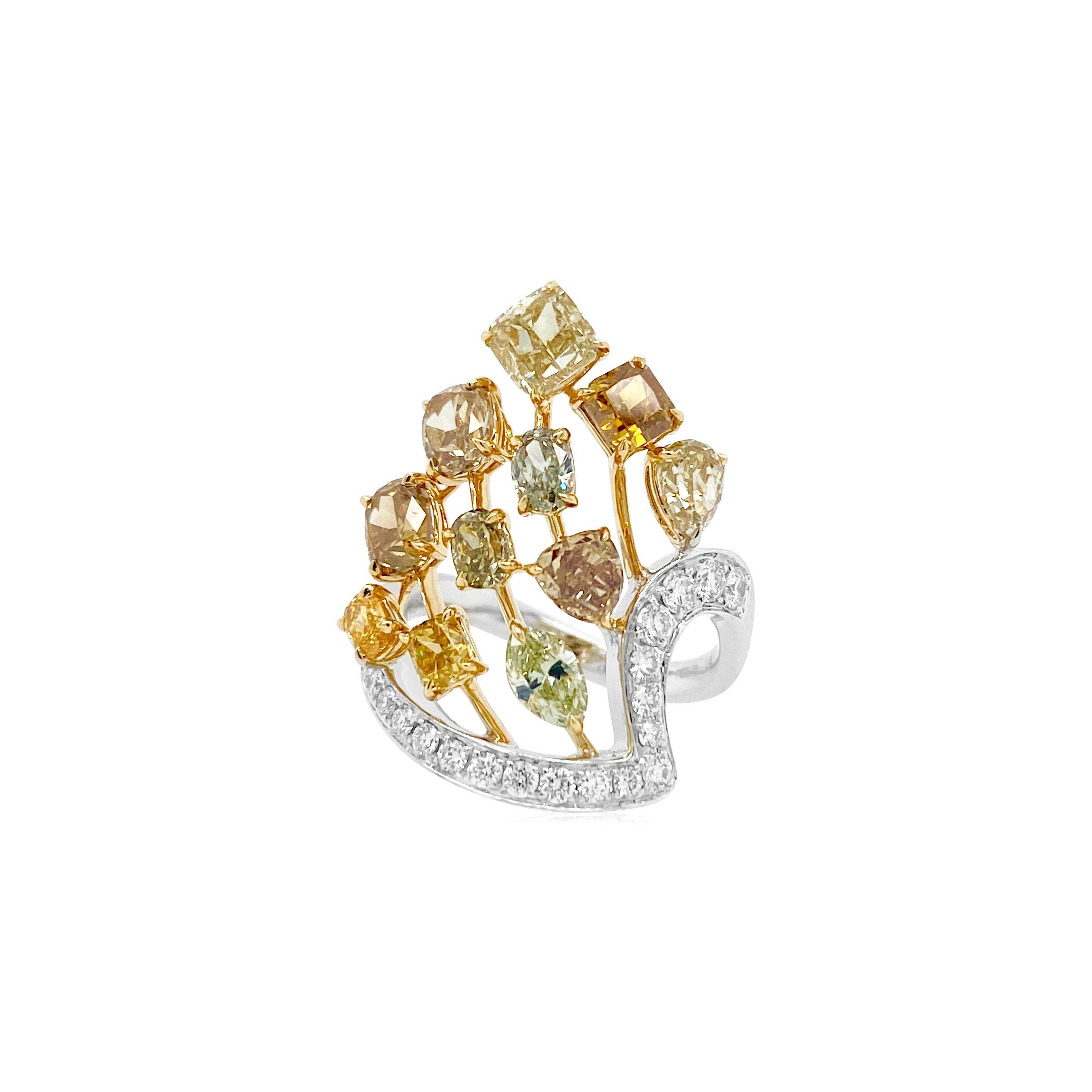 This ring has an opulent look with a Rare selection of Natural color diamonds including yellow, brown and greenish hues. Diamonds of different shapes and colors are brought together in a stylish design creating a unique piece perfect for a special