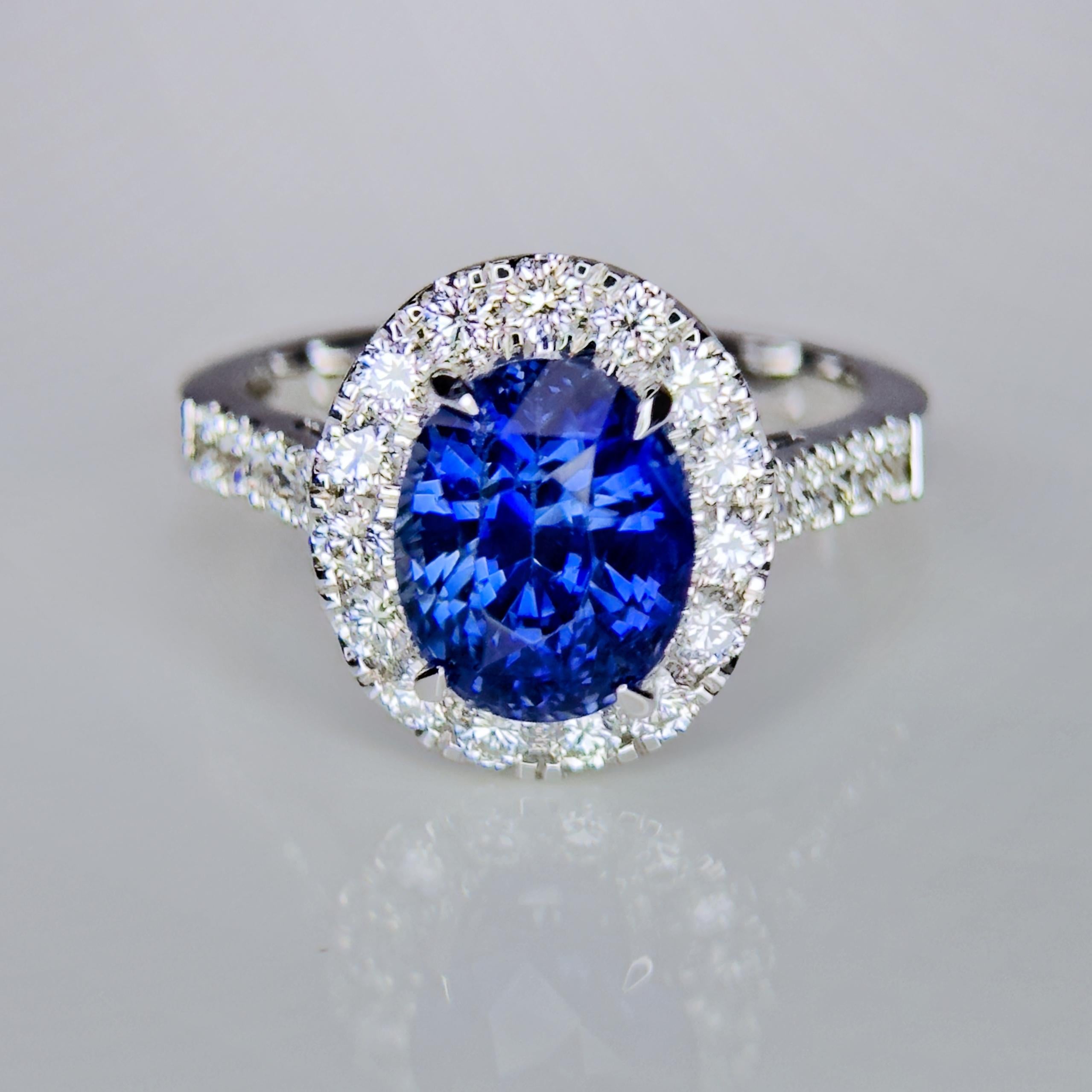 Stunning Royal Blue Kashmir Sapphire and Diamond halo ring, IGI Certified.

Centre Stone - Royal Blue Sapphire, 
Centre Stone Weight - 3.69 Carat, 
Centre Stone Origin  - Kashmir
IGI Report Number- 40J5212423

Total Number of Diamonds - 23,